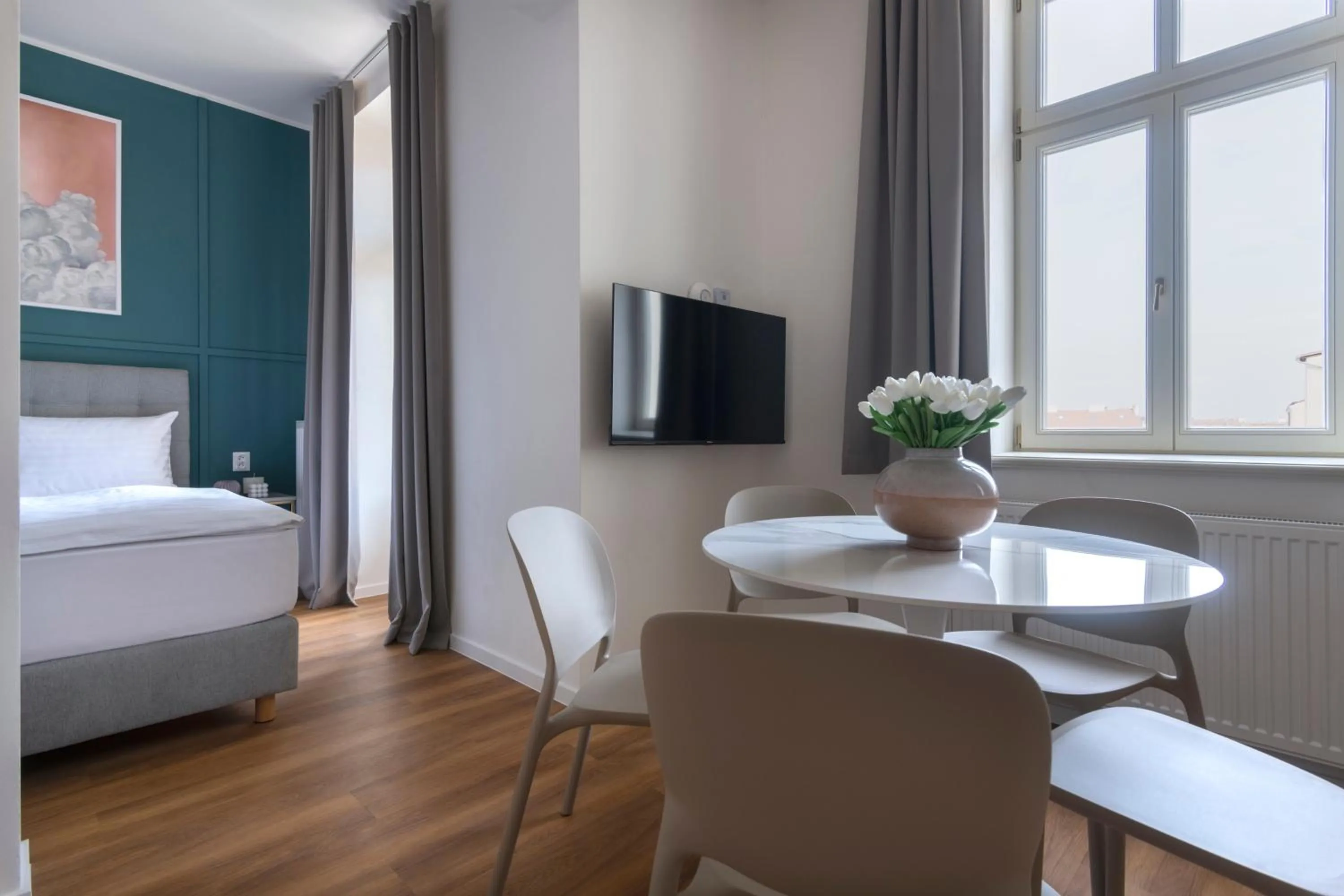 Dining area, Bed in Encore Boutique Residence by Dwellfort