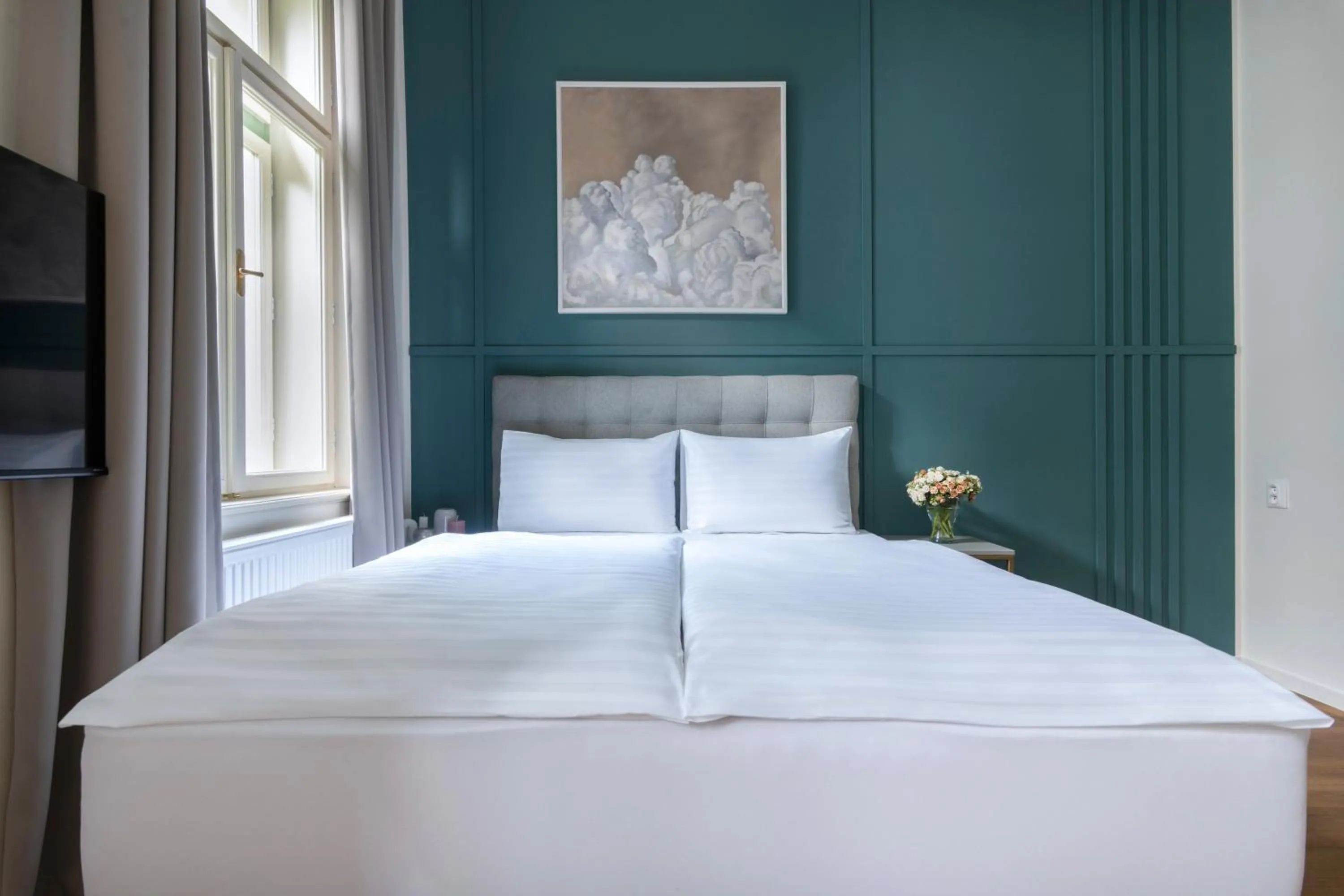 Bed in Encore Boutique Residence by Dwellfort