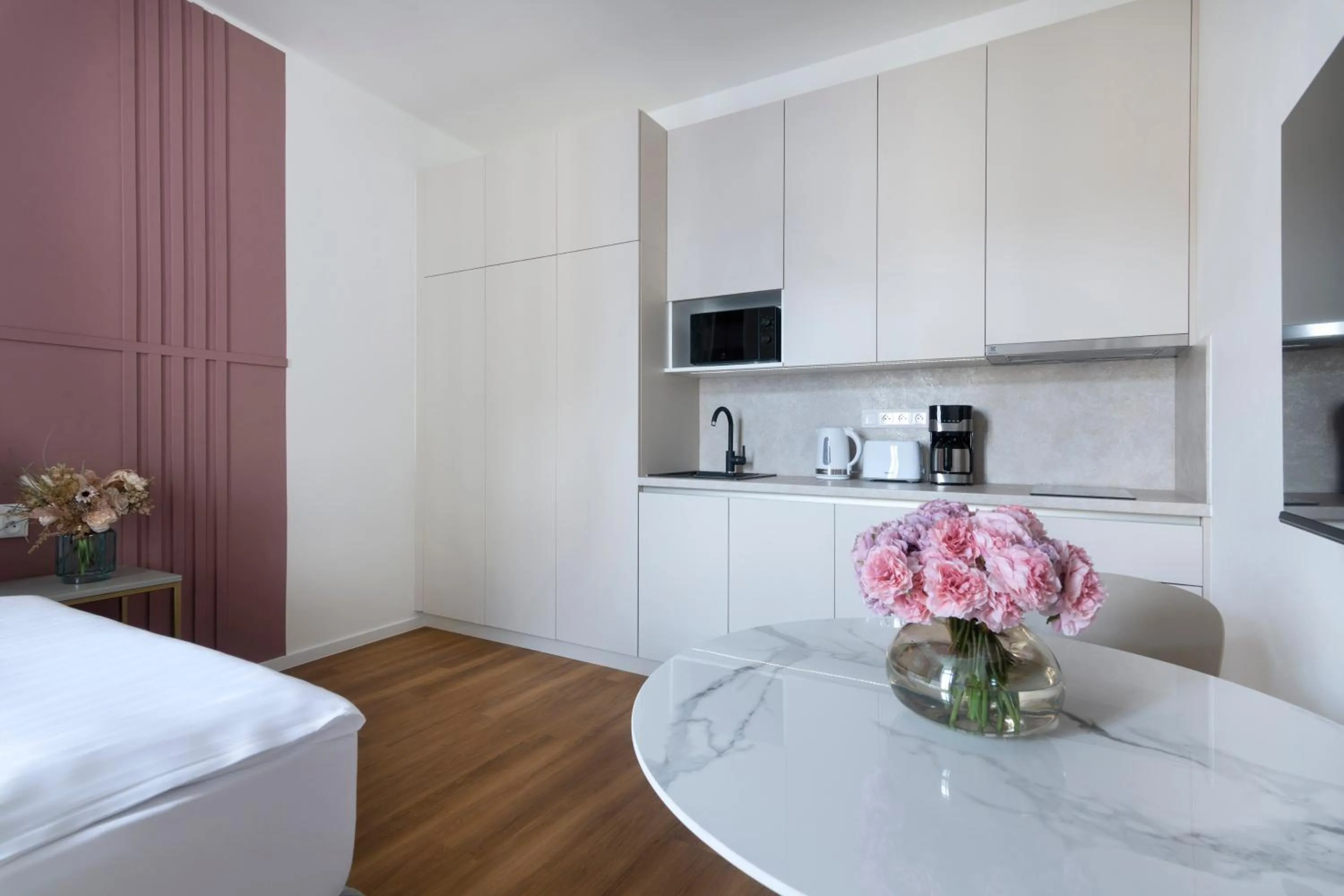 Dining area, Bed in Encore Boutique Residence by Dwellfort