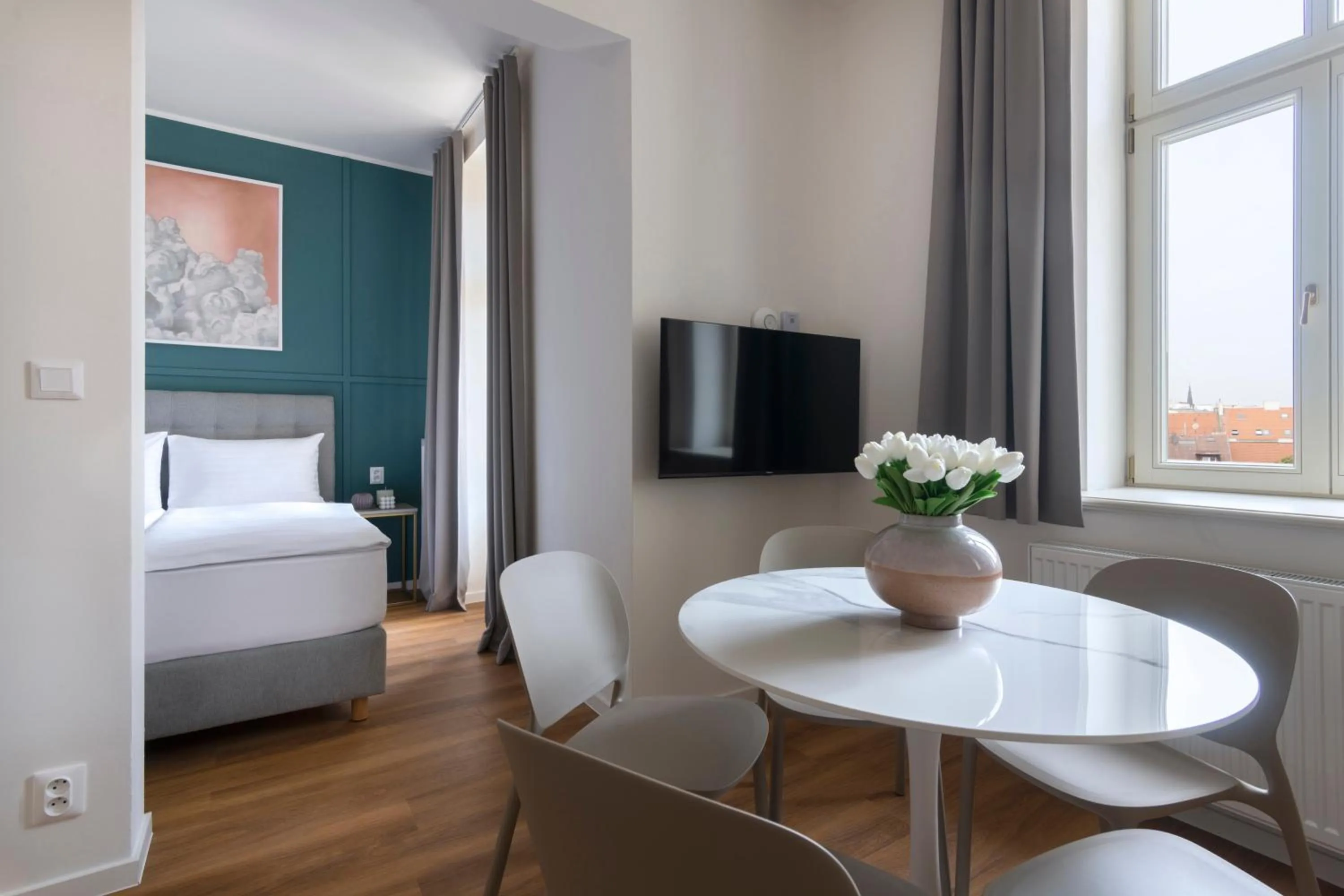 Dining area, Bed in Encore Boutique Residence by Dwellfort