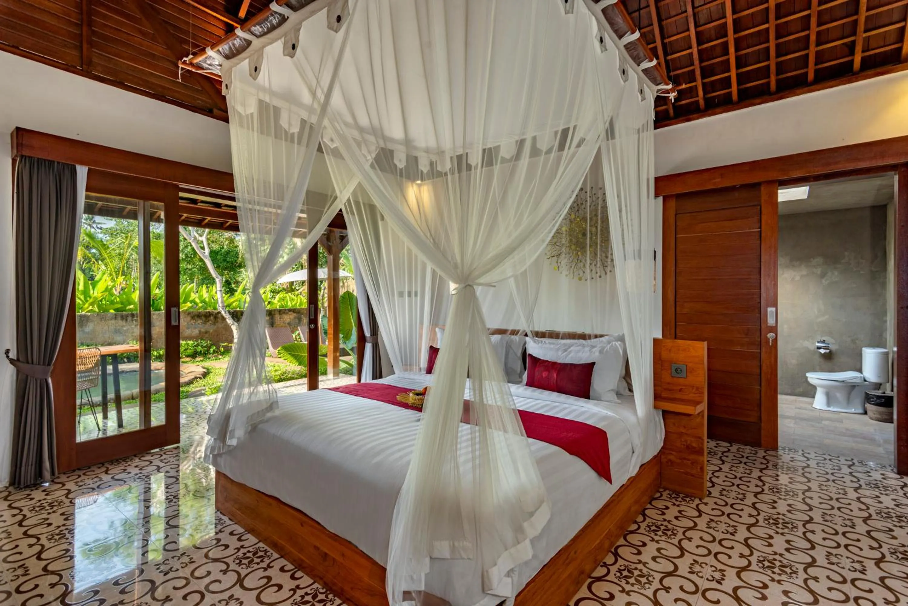 Bed in Tiare Villa Ubud by Dhananjaya Hospitality