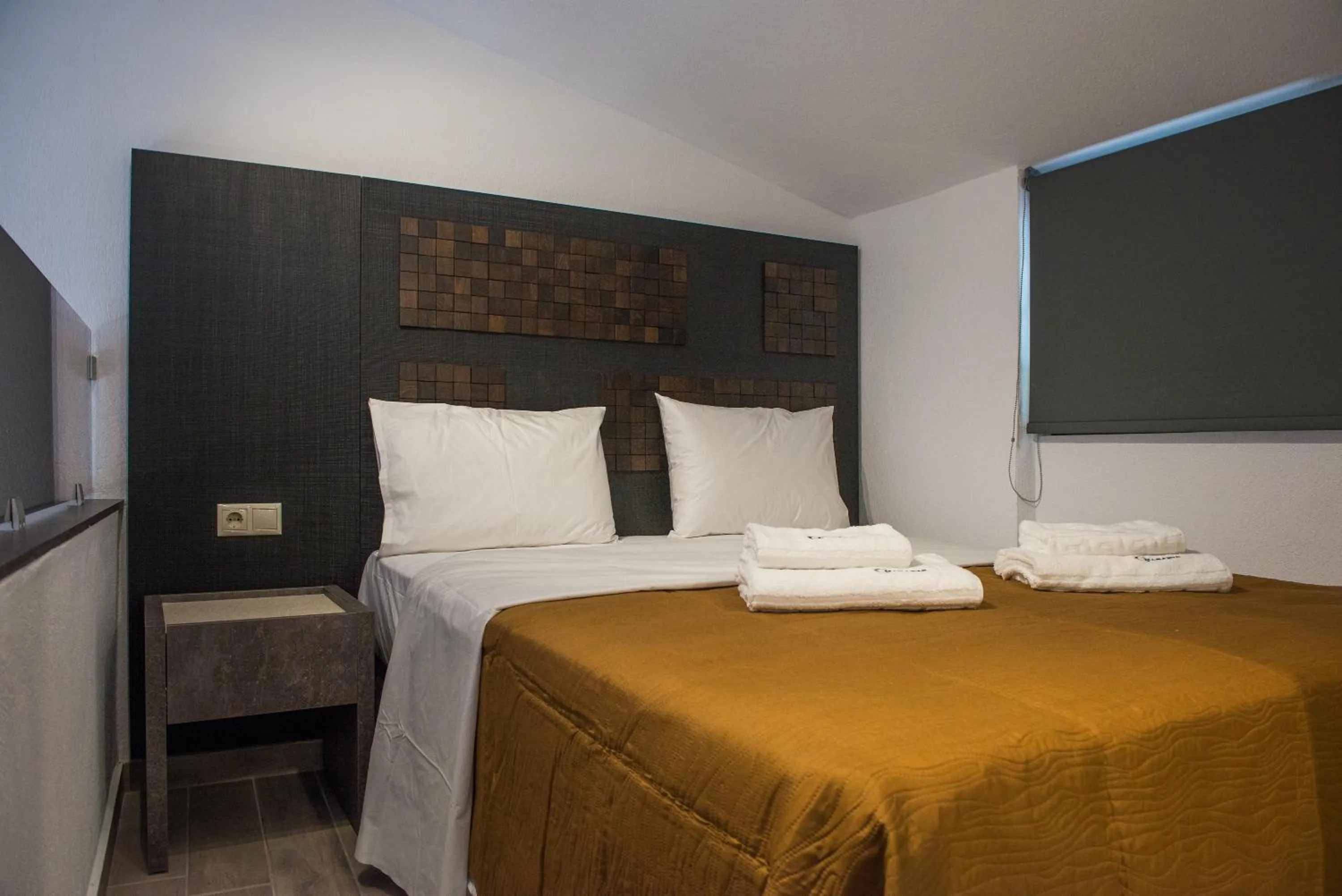 Bed in Chasapis Luxury Apartments&Studios