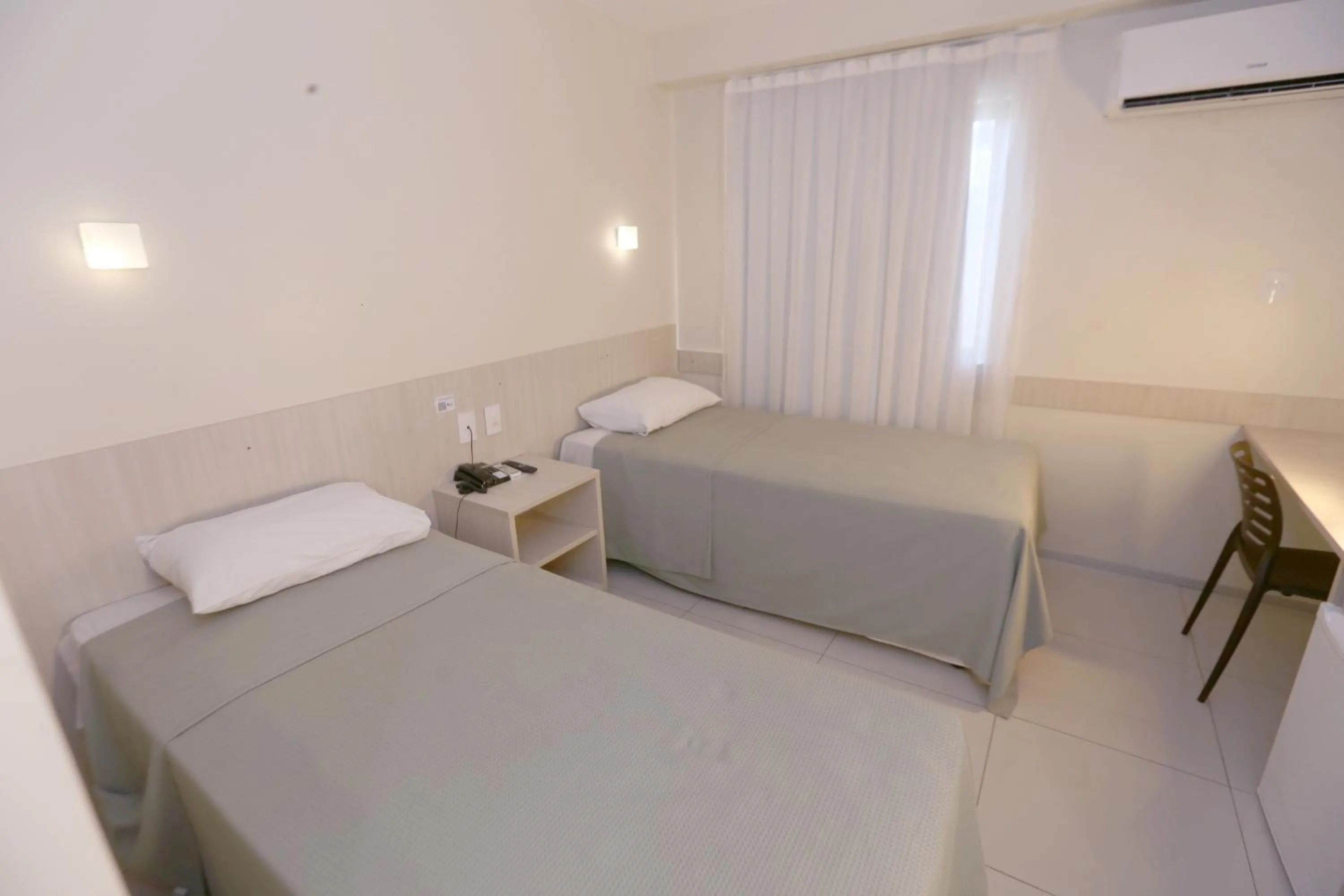 Bed in Stay Inn Hotel