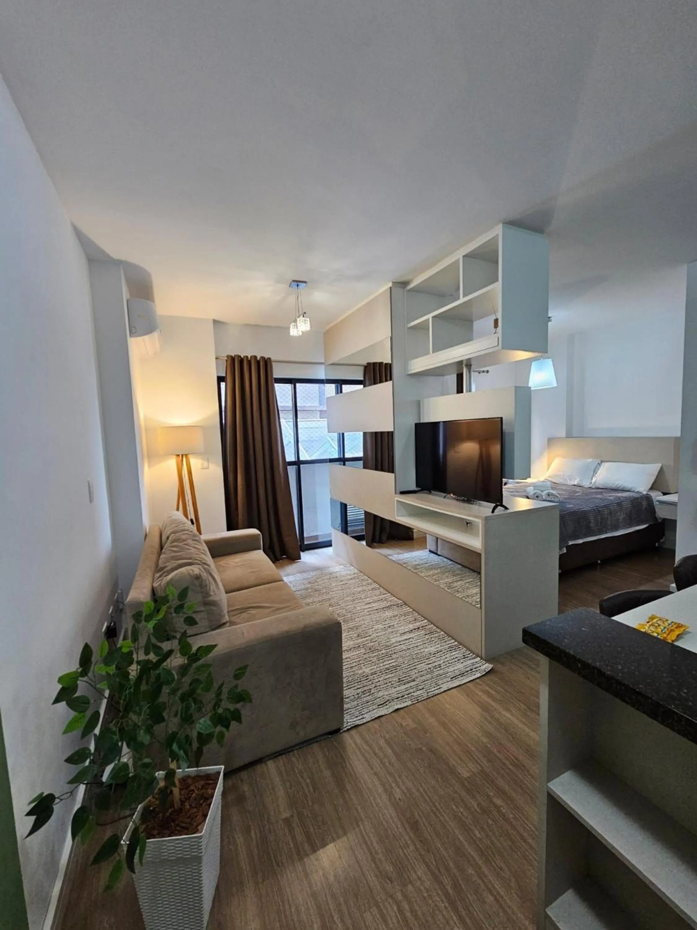 Living room, Bed in Apto em frente ao shopping com piscina aquecida