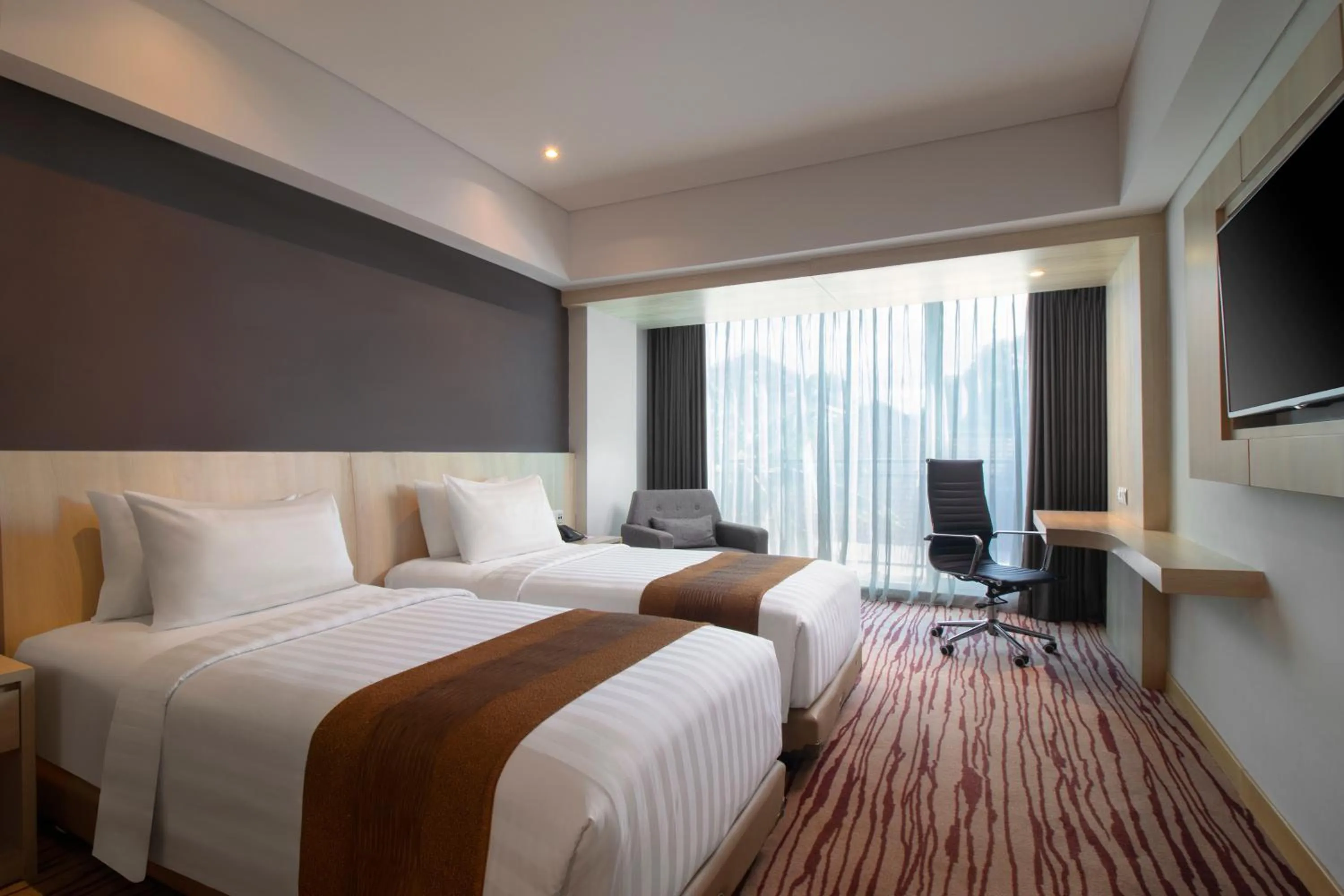 Bed in Sovereign Bali Hotel