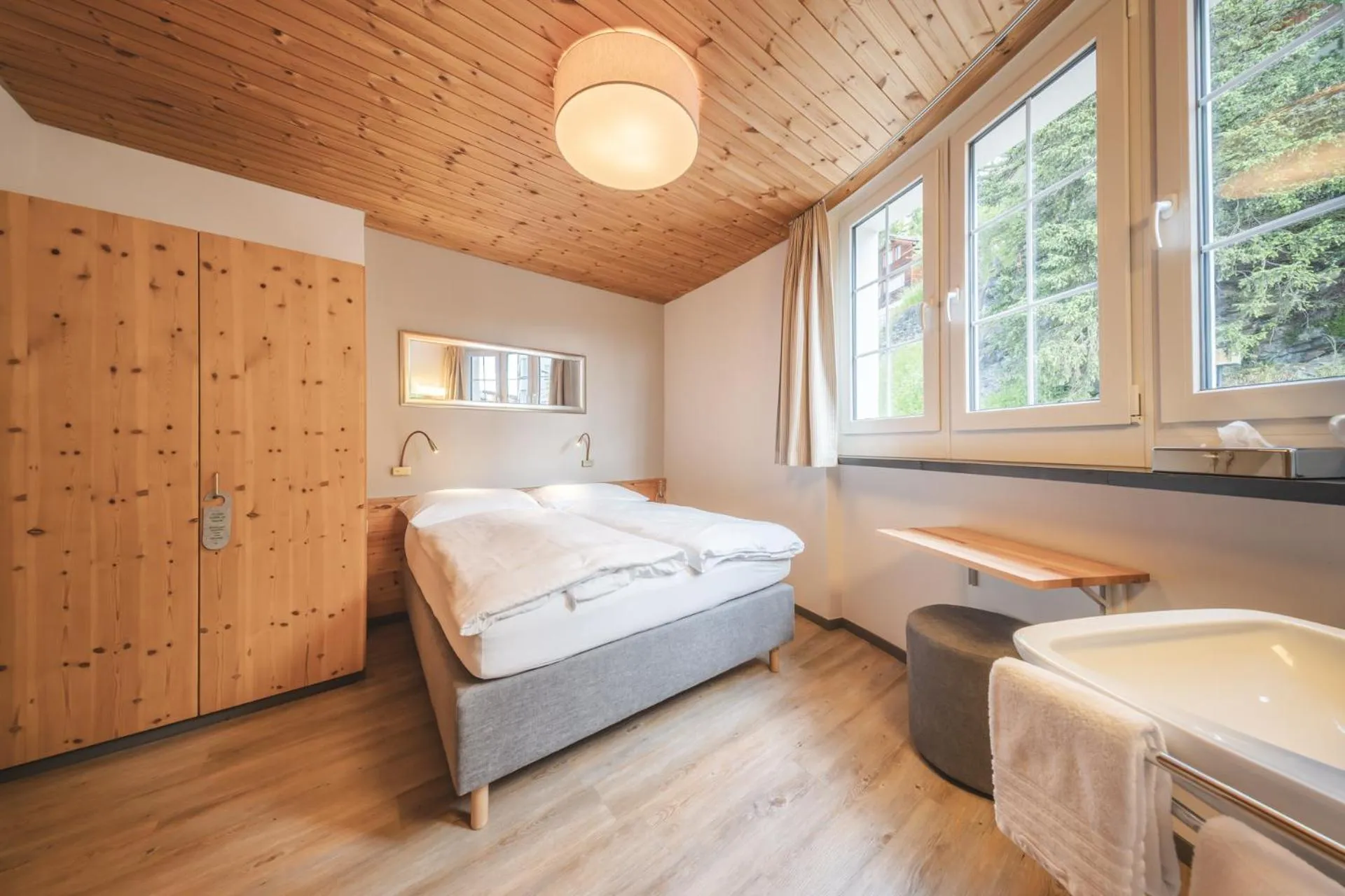 Photo of the whole room, Bed in Hotel Quellenhof - Self Check-in & Adults Only