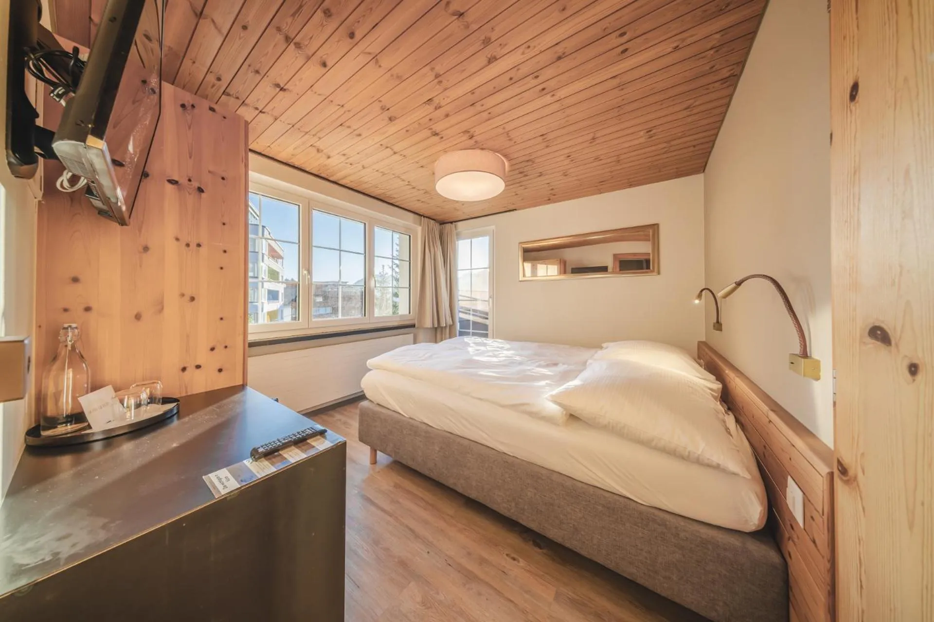 Photo of the whole room, Bed in Hotel Quellenhof - Self Check-in & Adults Only