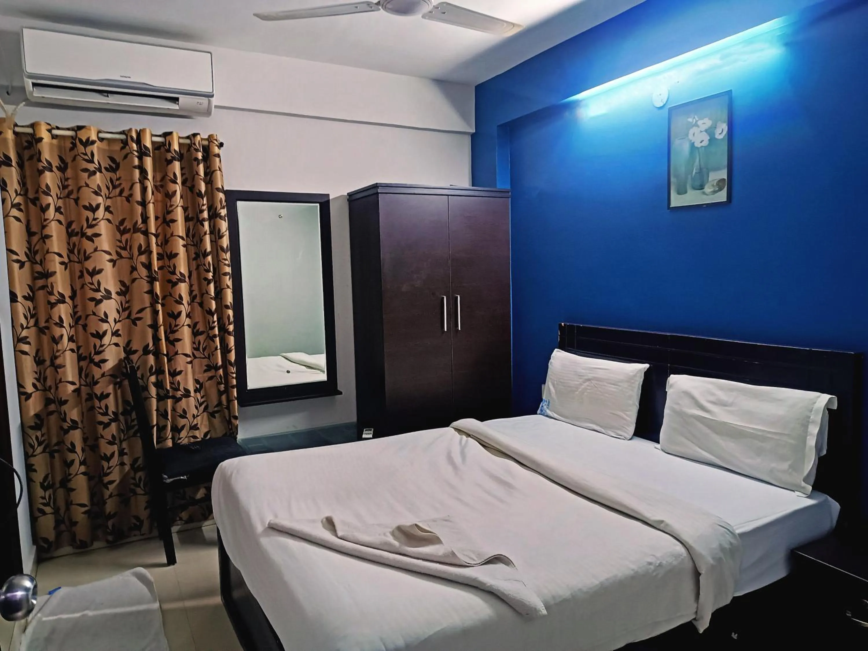 Bedroom in Delta Inn Madiwala