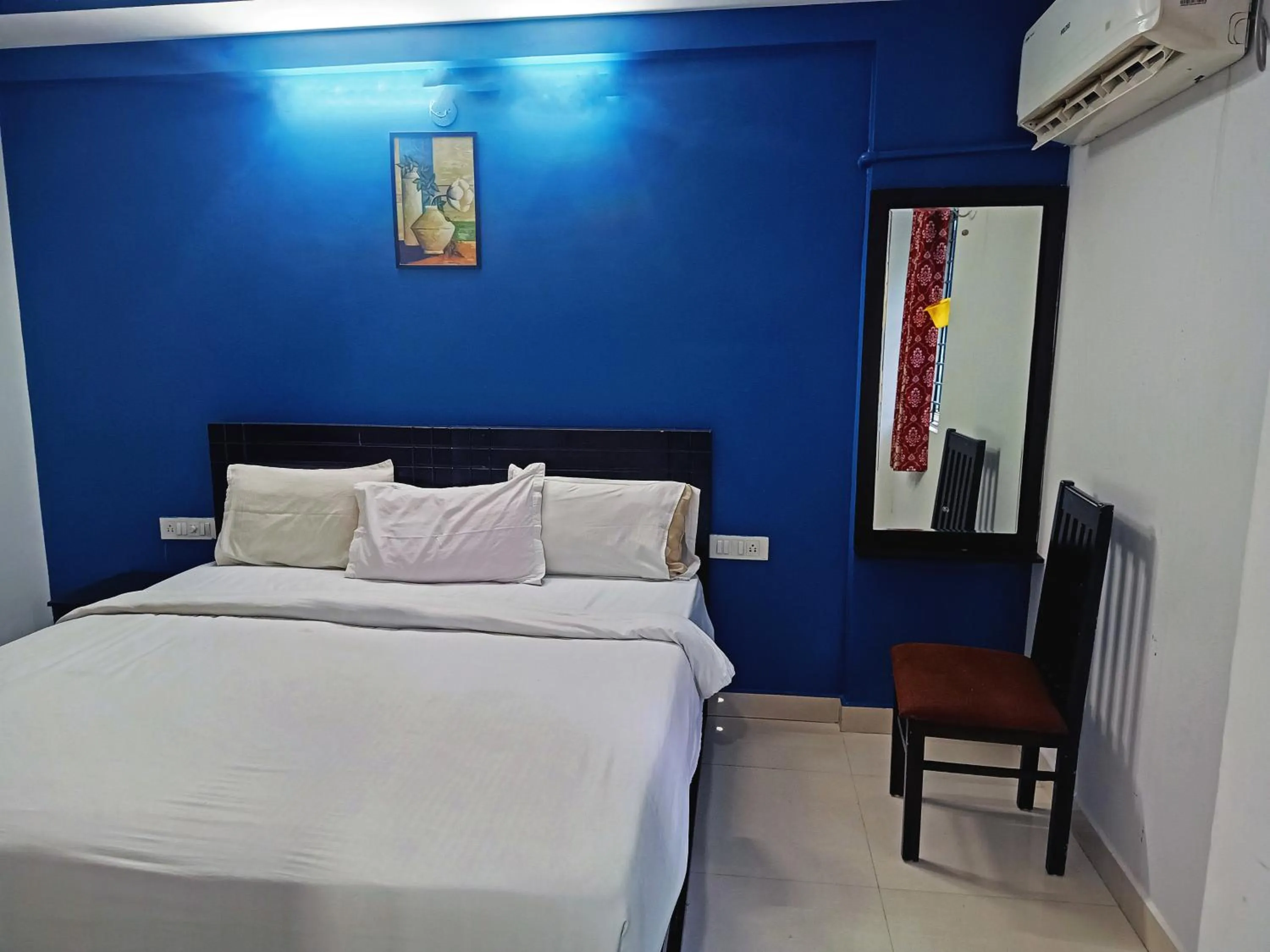 Bedroom in Delta Inn Madiwala