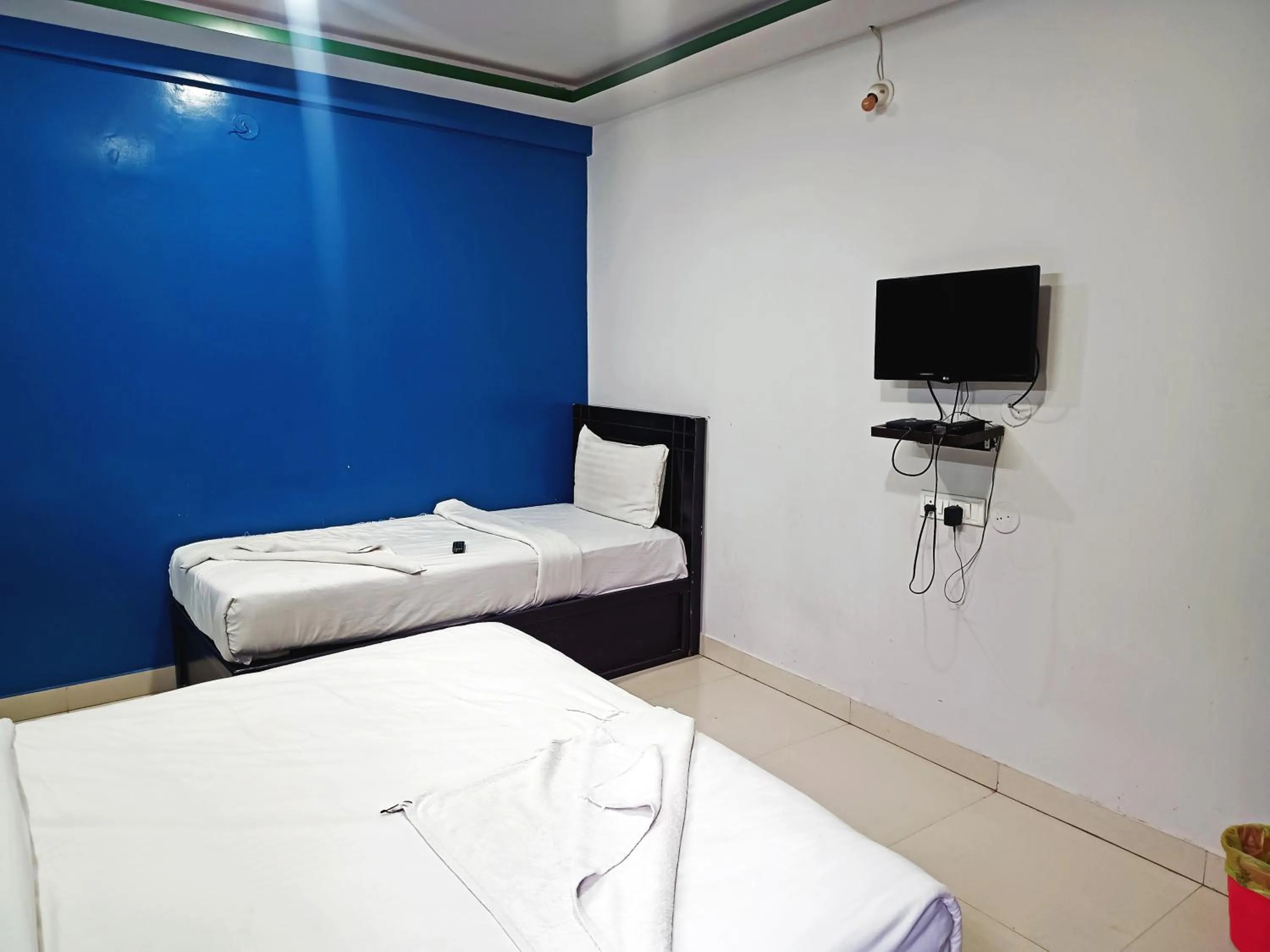 Bedroom in Delta Inn Madiwala