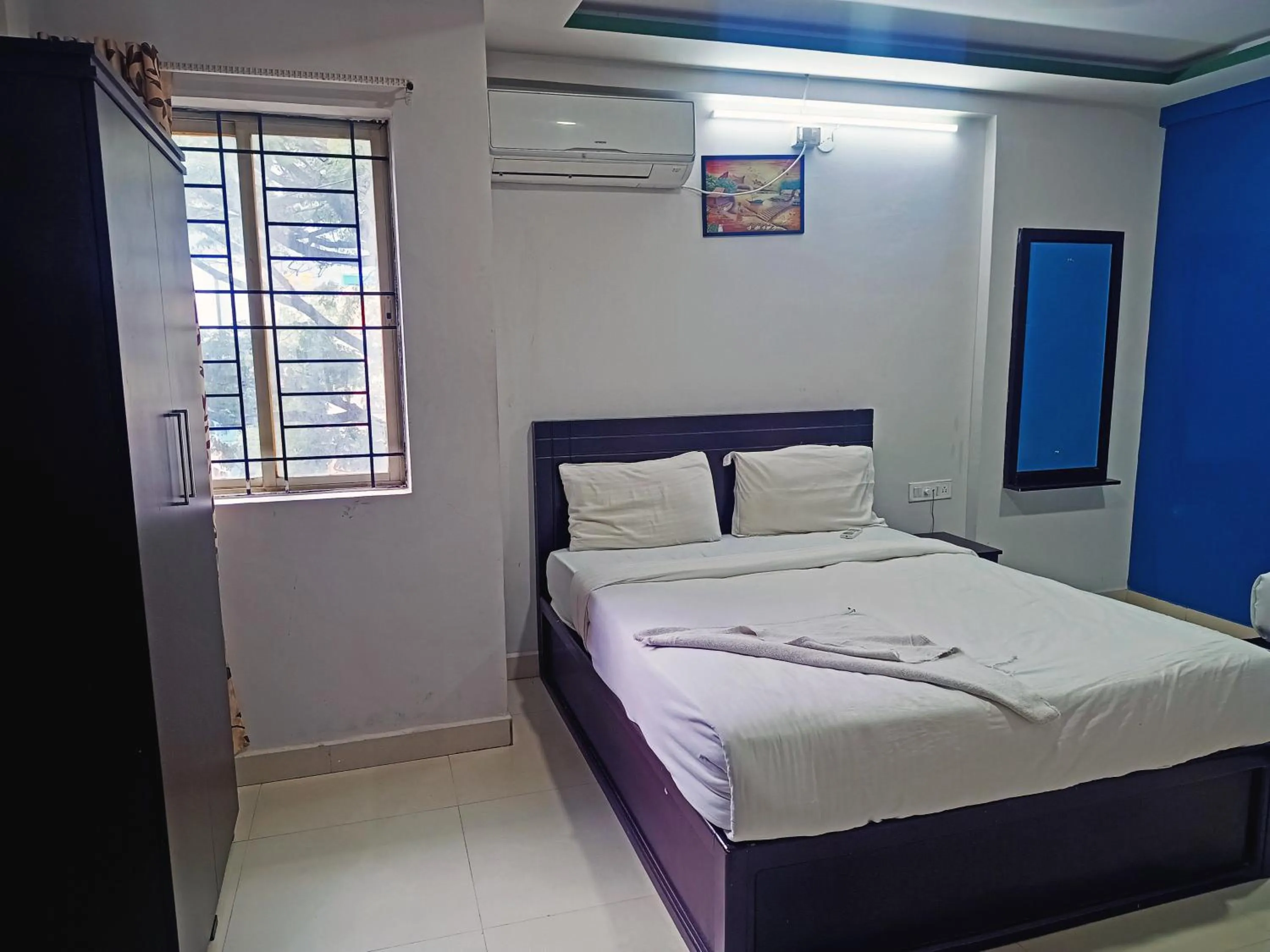 Bedroom in Delta Inn Madiwala