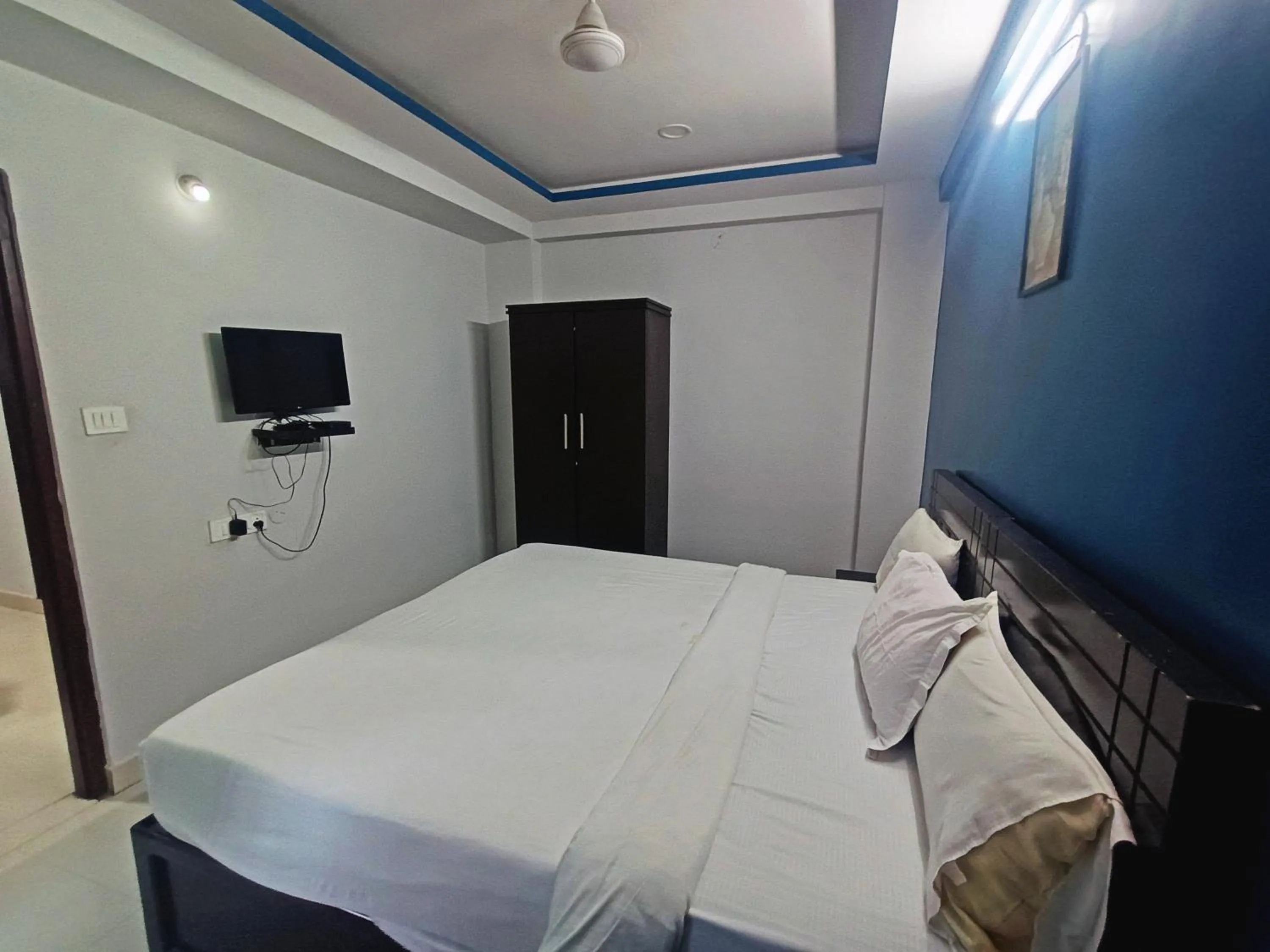 Bedroom in Delta Inn Madiwala