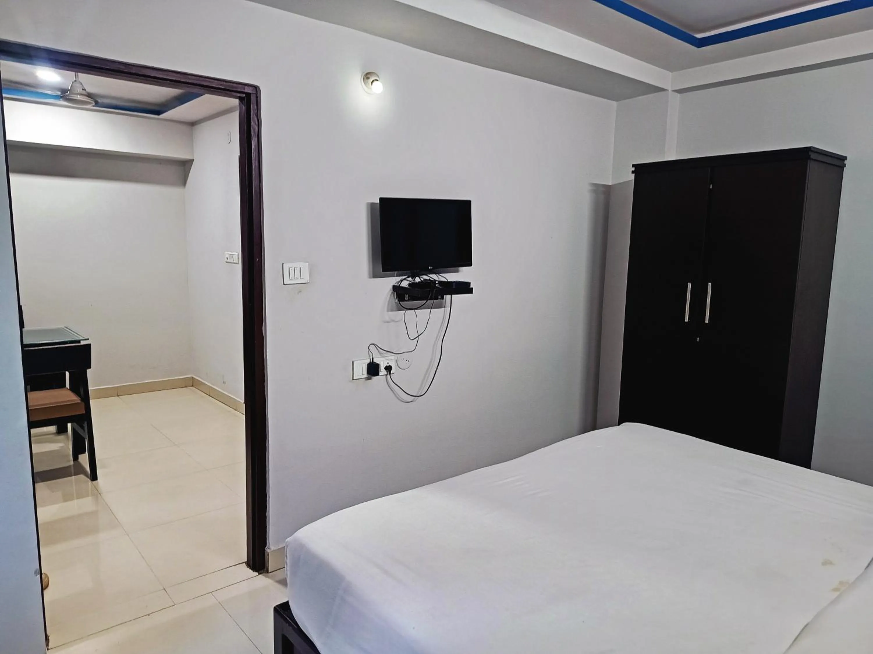 Bedroom in Delta Inn Madiwala