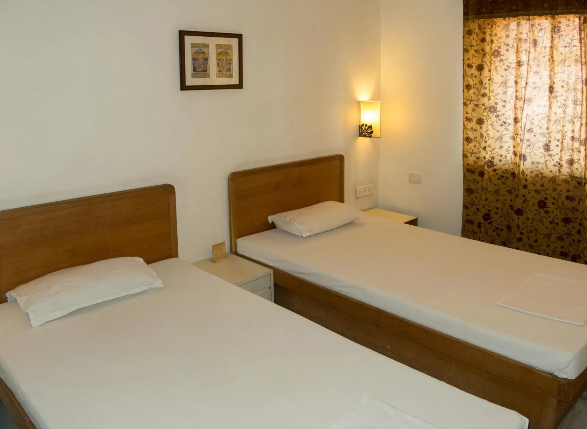 Bed in Atithi Guest House