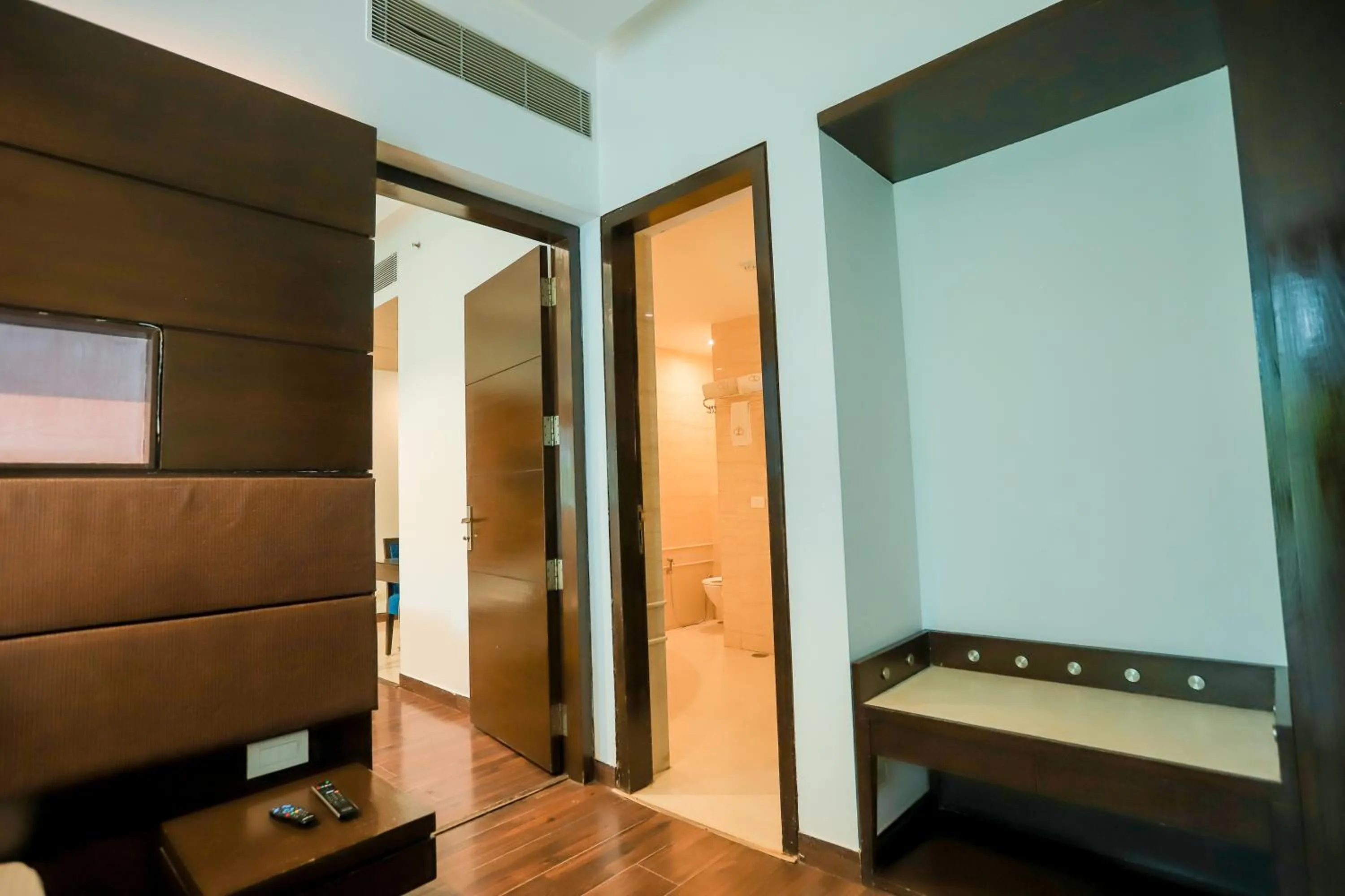 Communal lounge/ TV room, Bed in Bel-La Monde Hotel Chhattarpur South Delhi