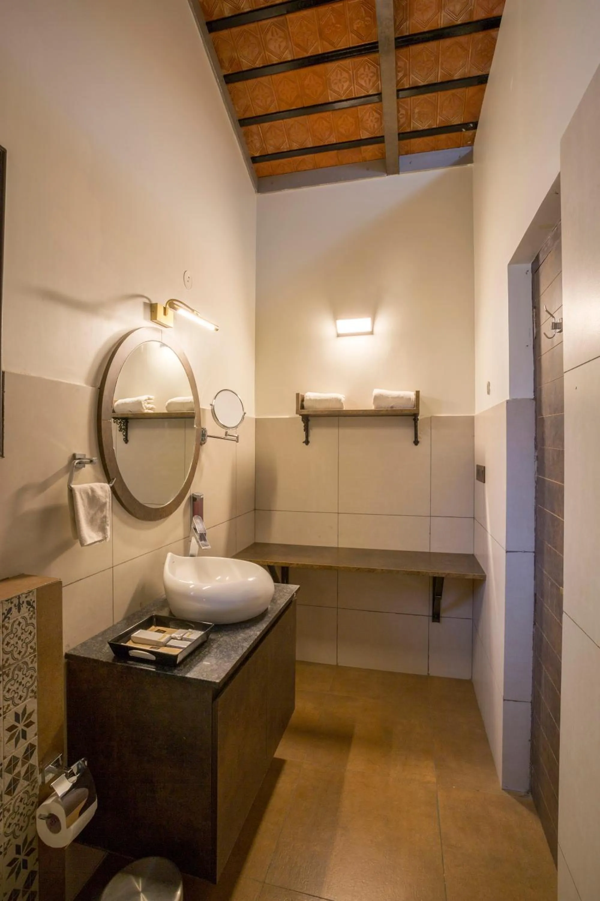 Bathroom in Nirantara Resort & Spa