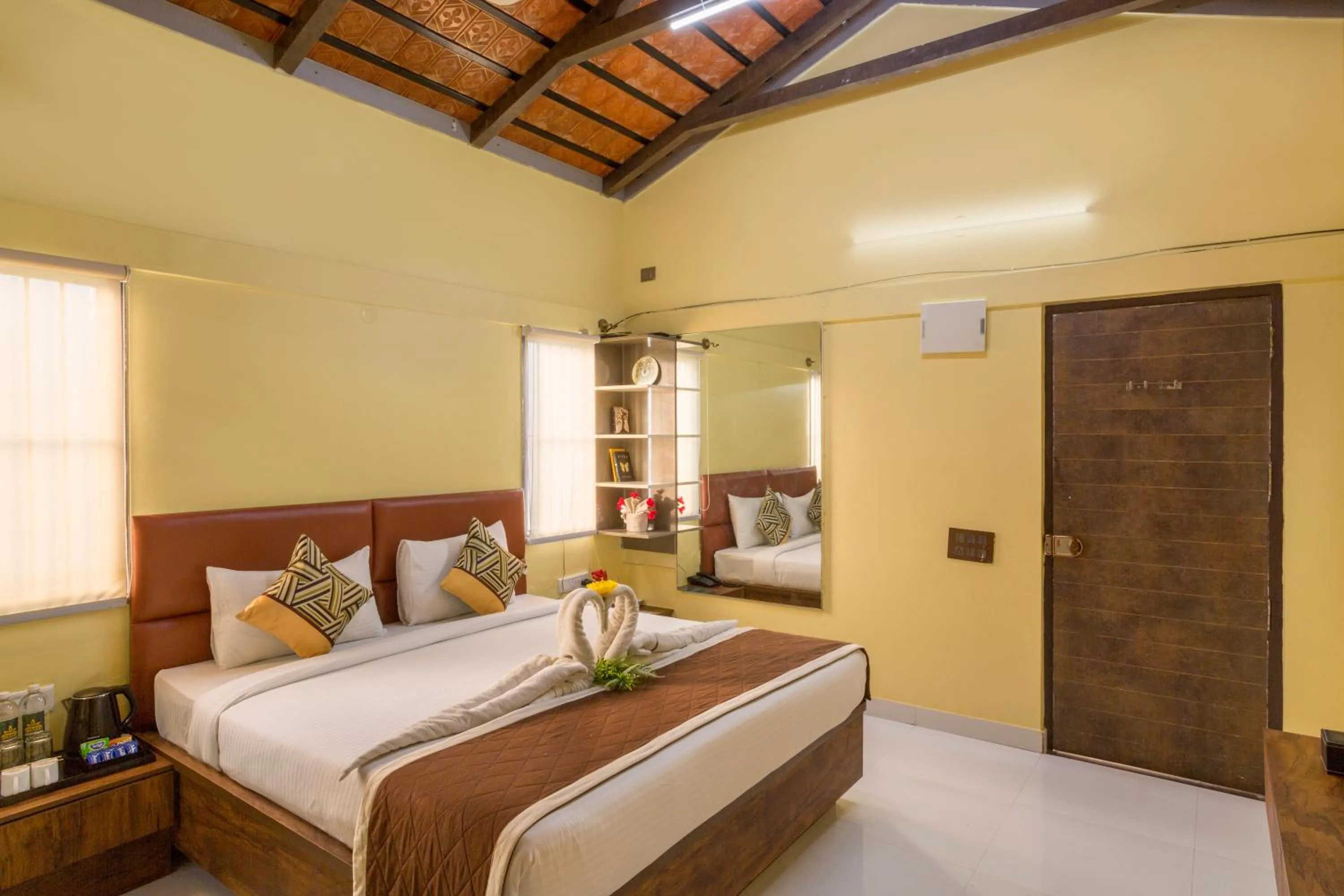 Bed in Nirantara Resort & Spa