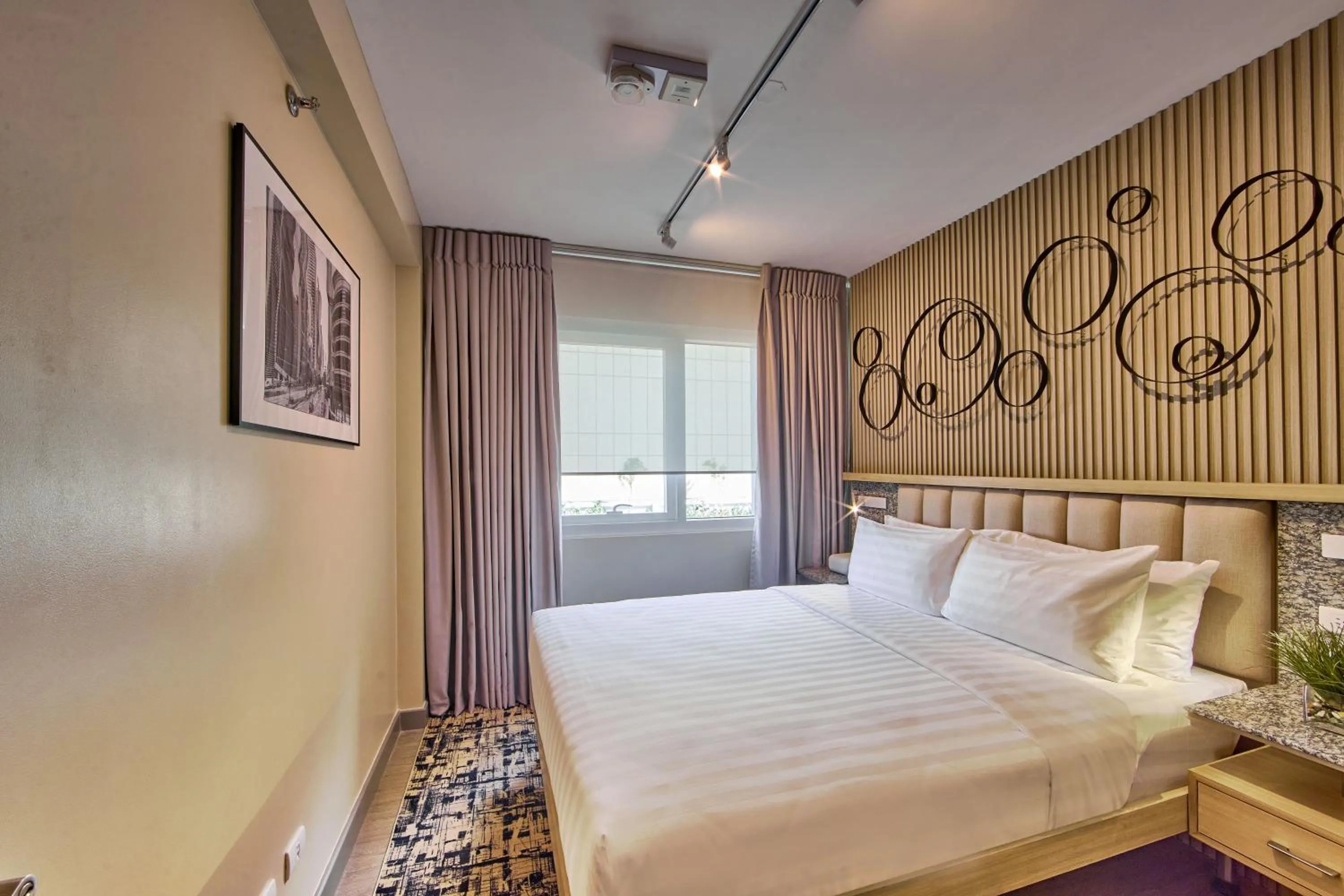 Bed in The Connor Serviced Residences Managed by HII