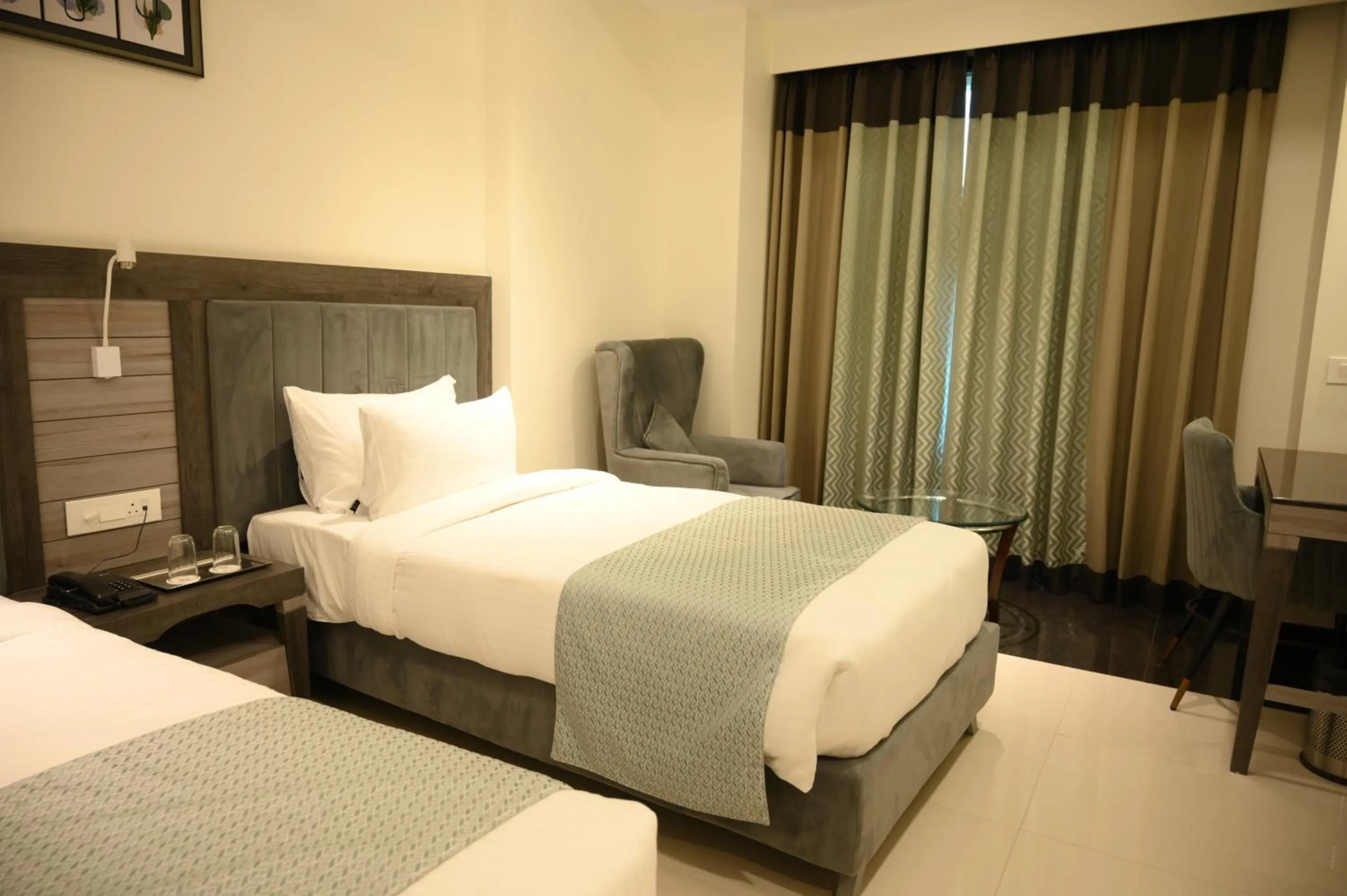 Bed in The Mudra Hotel