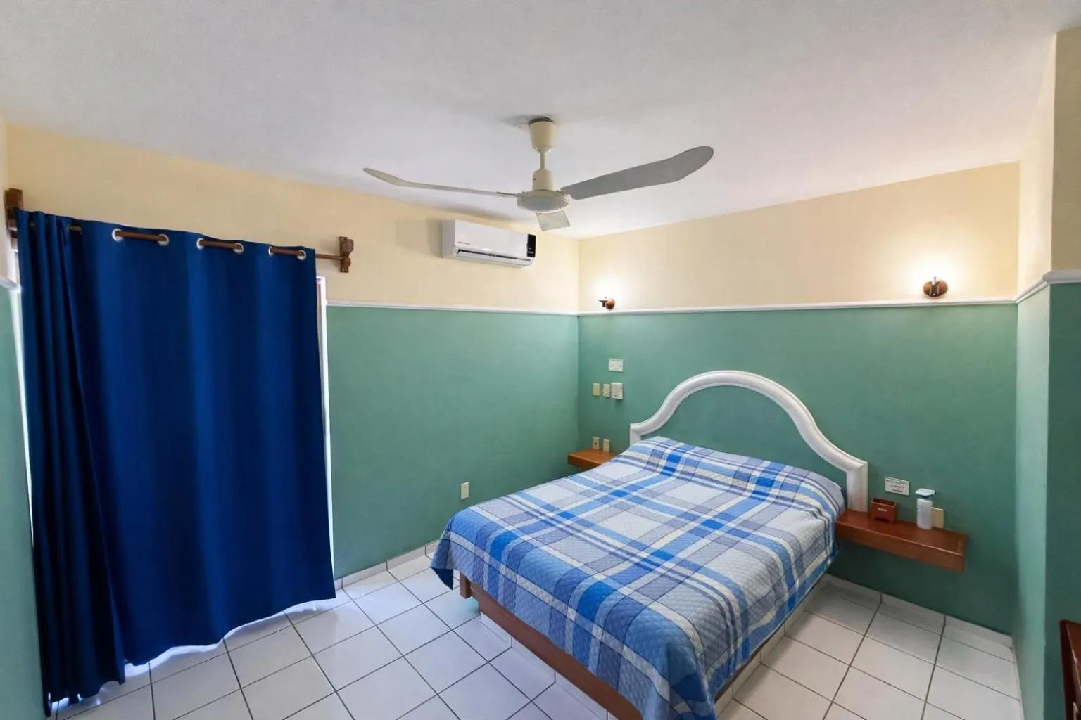 Photo of the whole room, Bed in Blue Pacific Suites