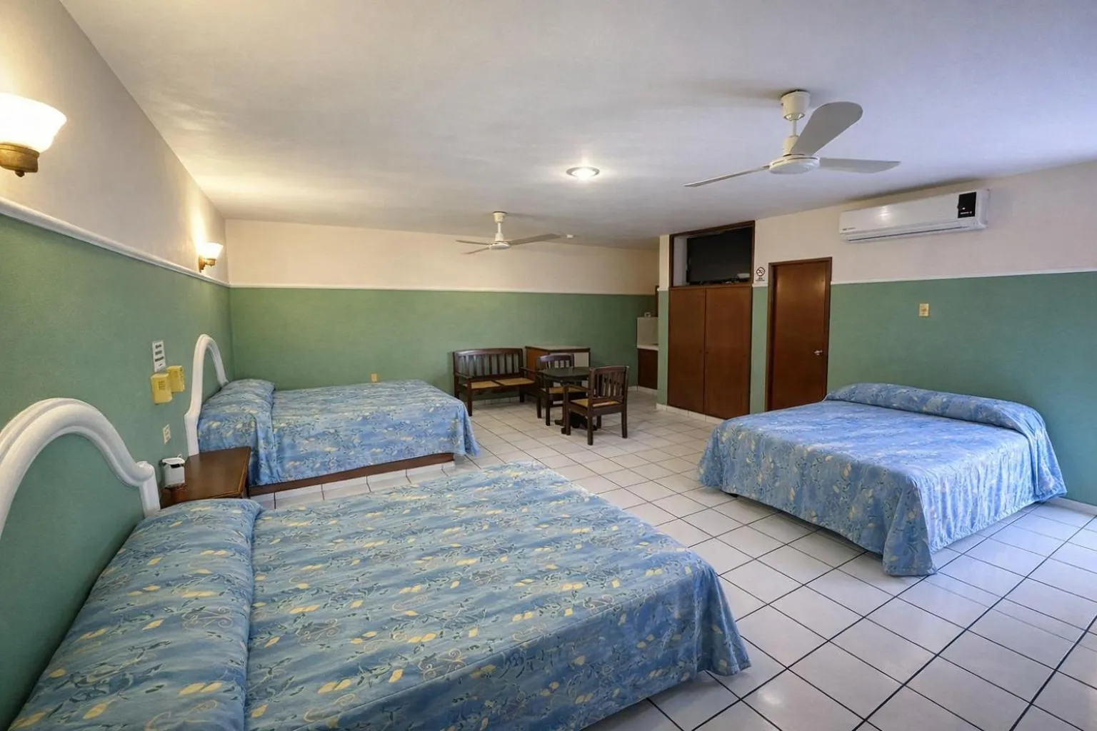 Photo of the whole room, Bed in Blue Pacific Suites