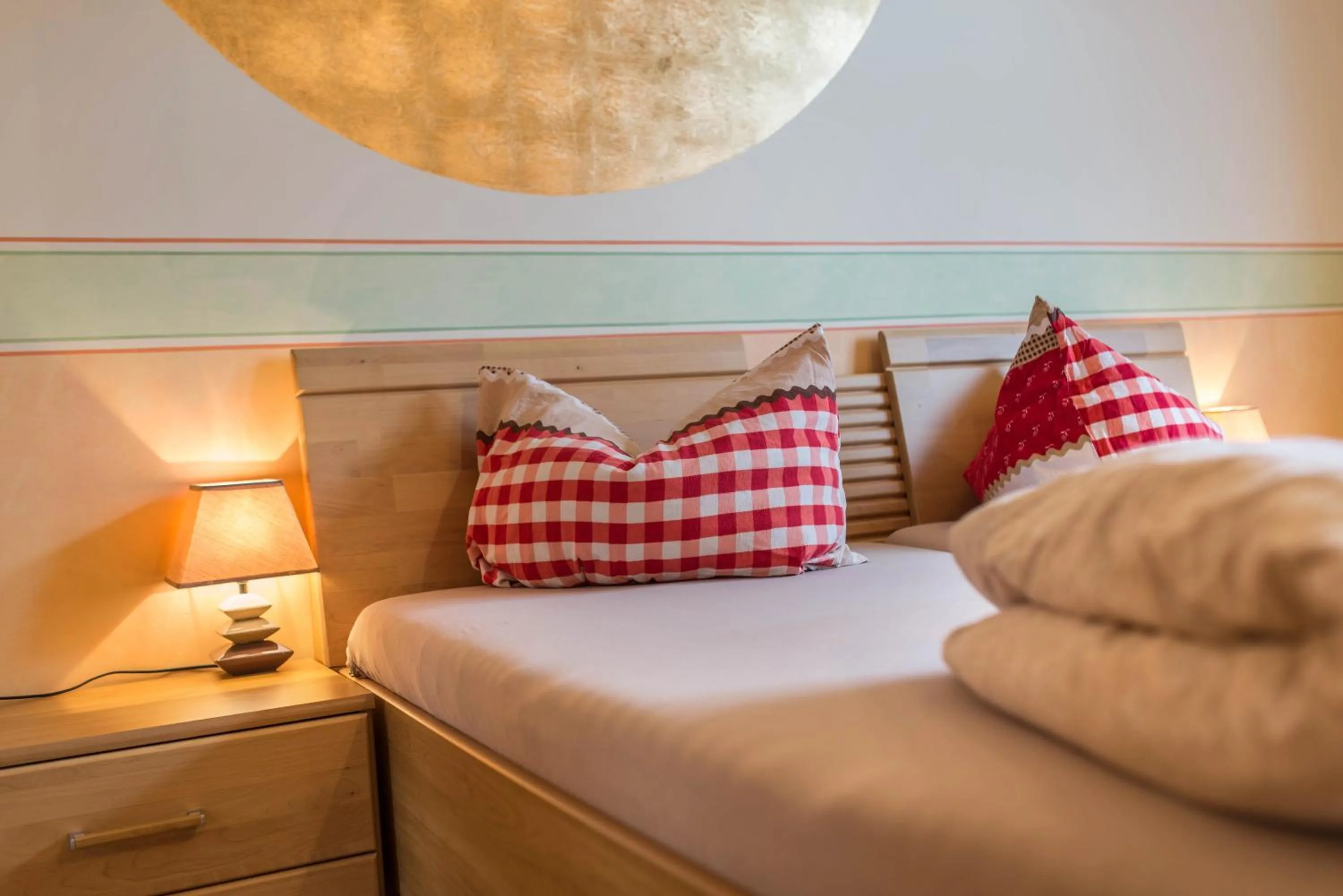 Bed in SCHUSTERjunge Aparthotel