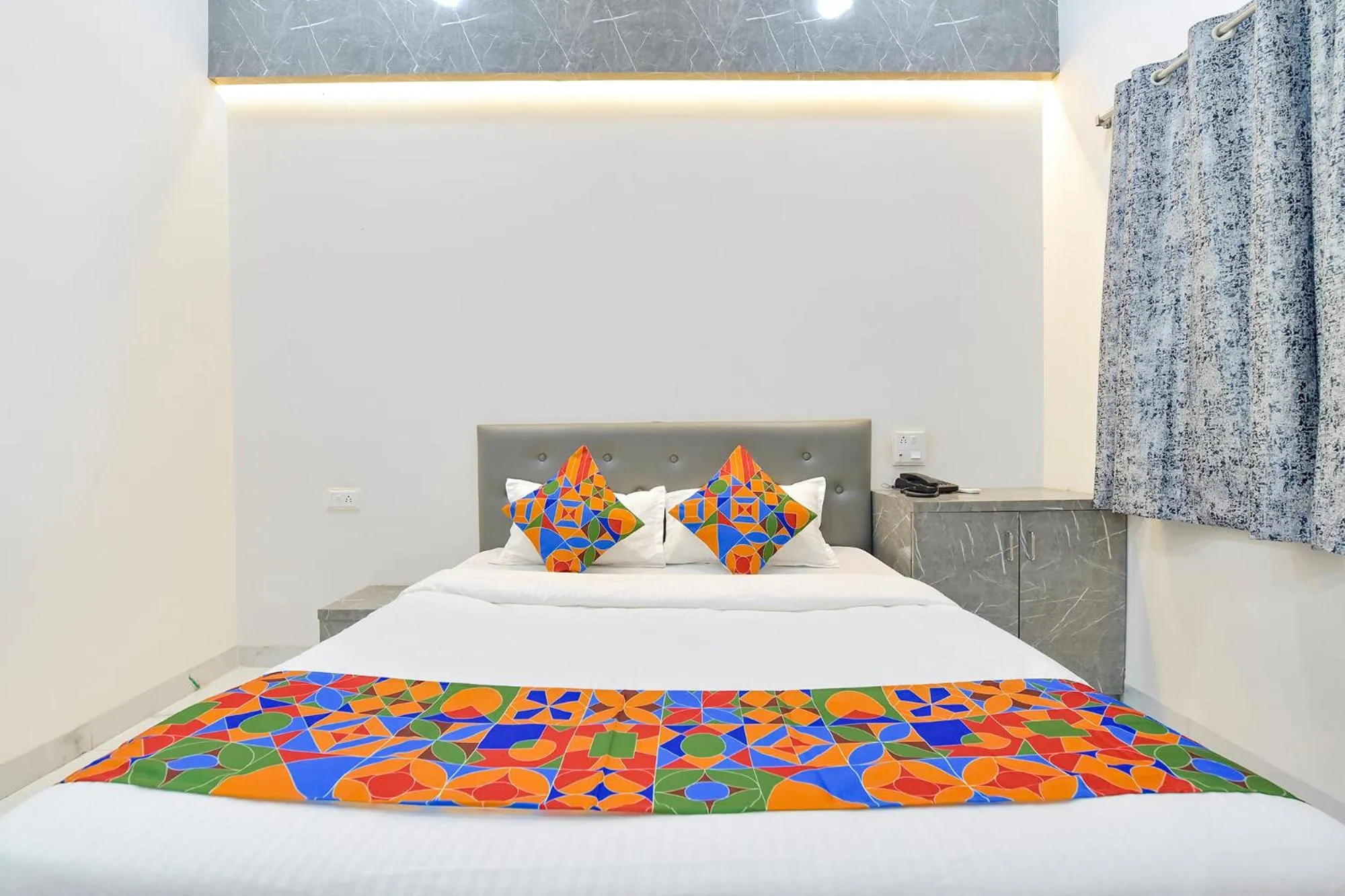 Bed in FabHotel Grand Embassy