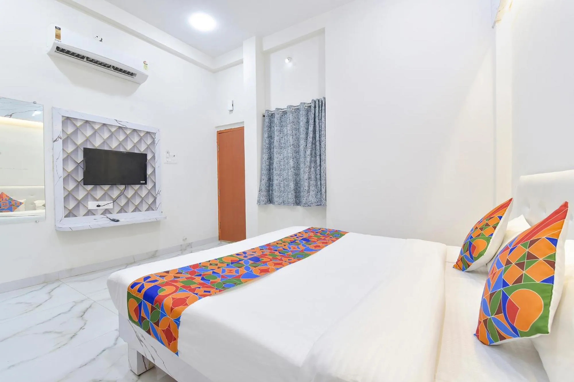 Bed in FabHotel Grand Embassy