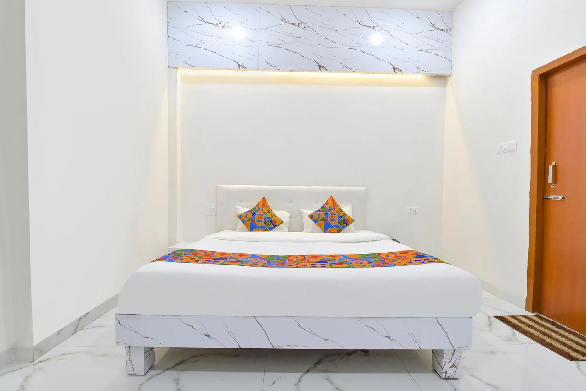 Bed in FabHotel Grand Embassy