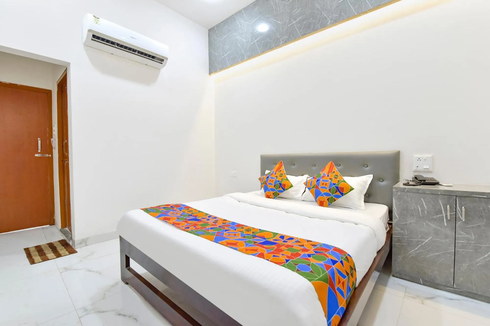 Bed in FabHotel Grand Embassy