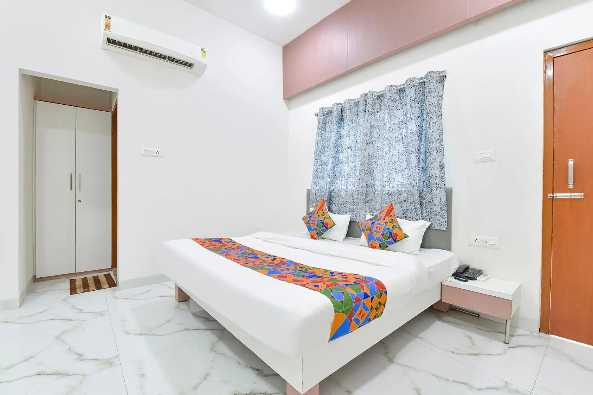 Bed in FabHotel Grand Embassy