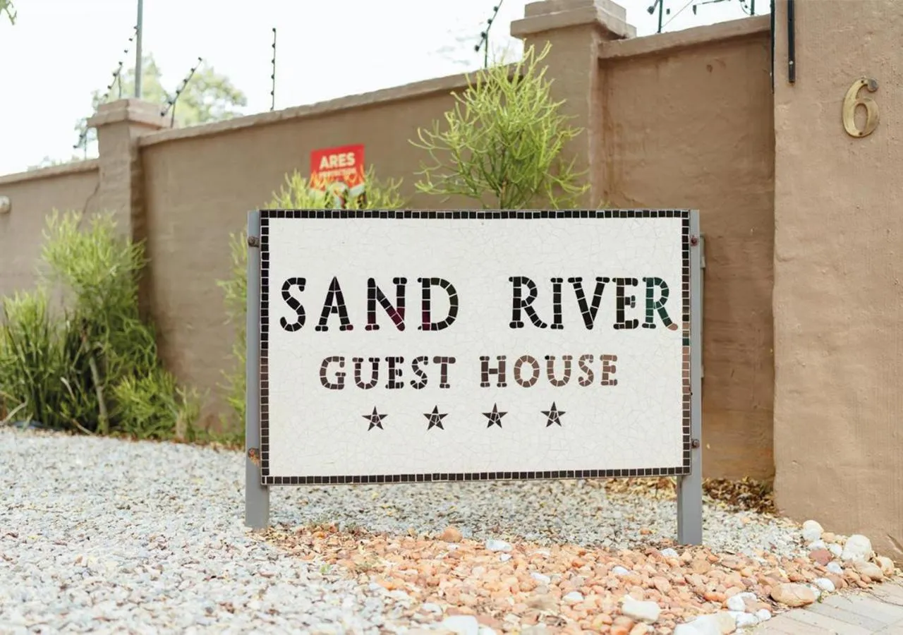 Property logo or sign in Sand River Guest House