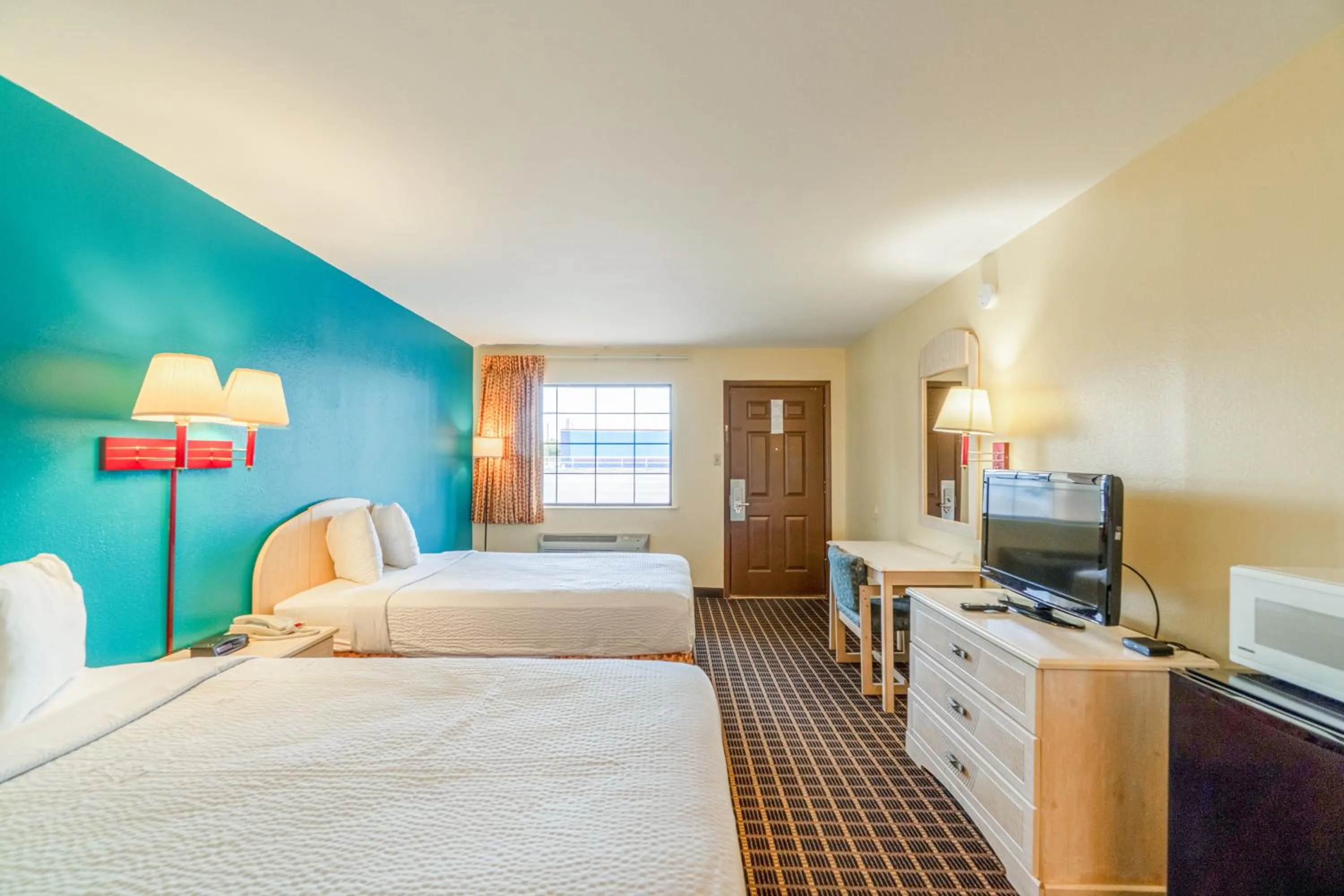 Bedroom, Bed in Shale Inn Andrews by OYO