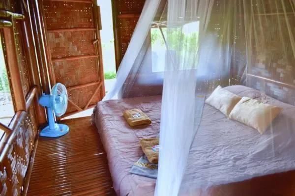 Bed in Micky Monkey Beach Hotel Phuket Maikhao Thailand