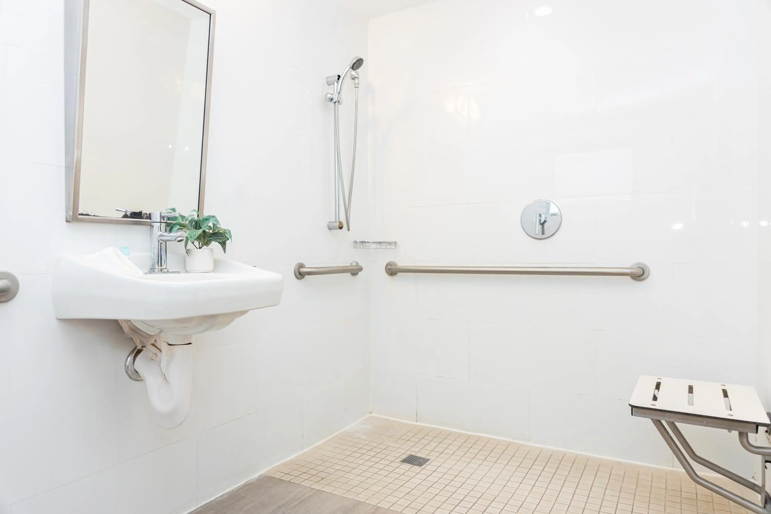Bathroom in Beachside All Suites Hotel