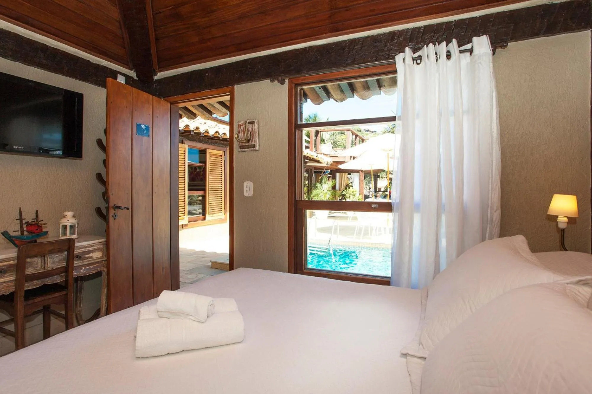 Bed in Pousada Praia João Fernandes