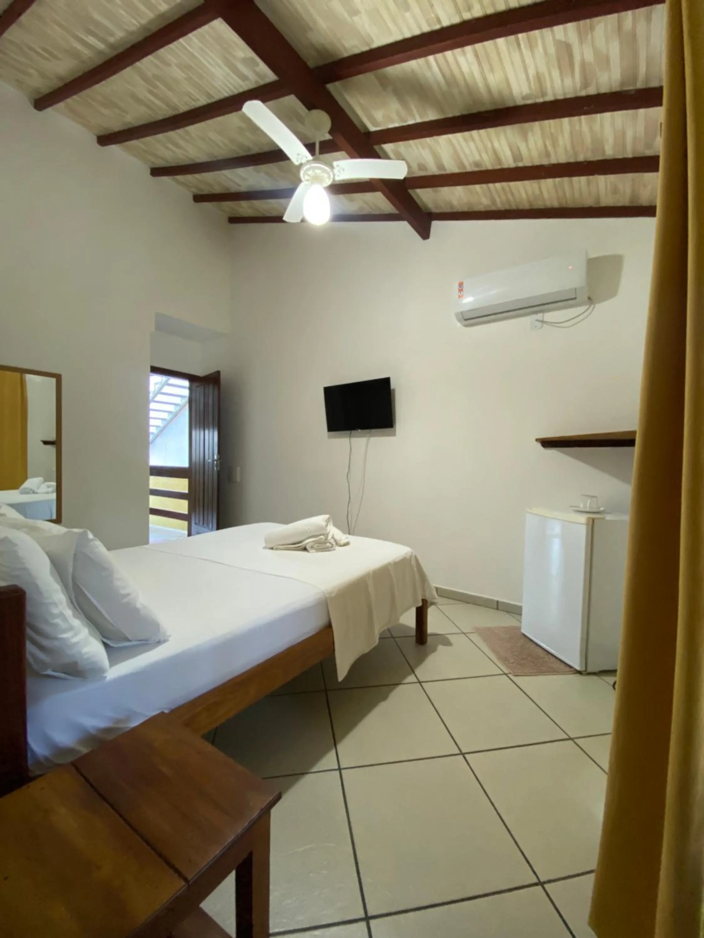 Bed in Pousada Arraial Suites