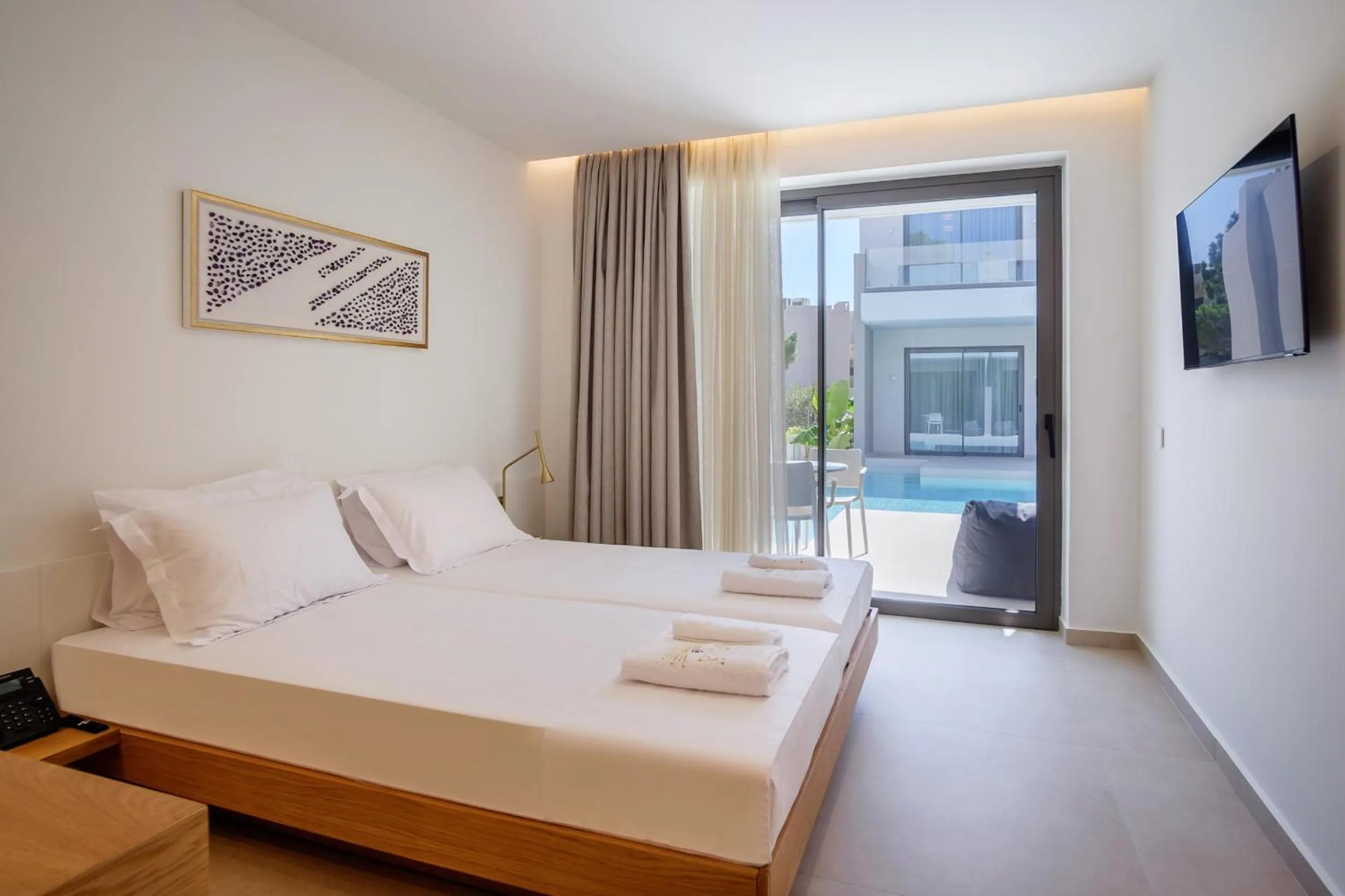 Bed in Phos Hotel Adults Only