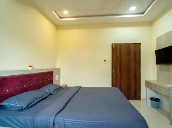 Bed in Majestic Hotel and Restro