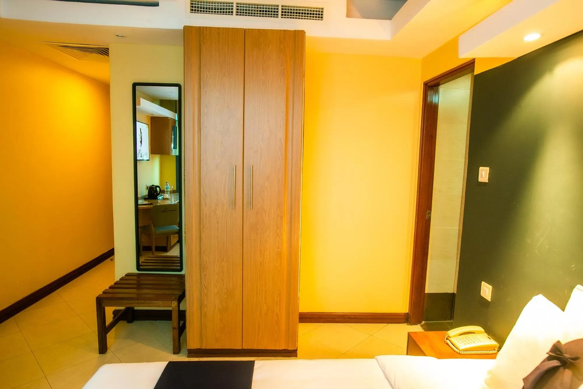 Bed in Parrot Hotel Arusha