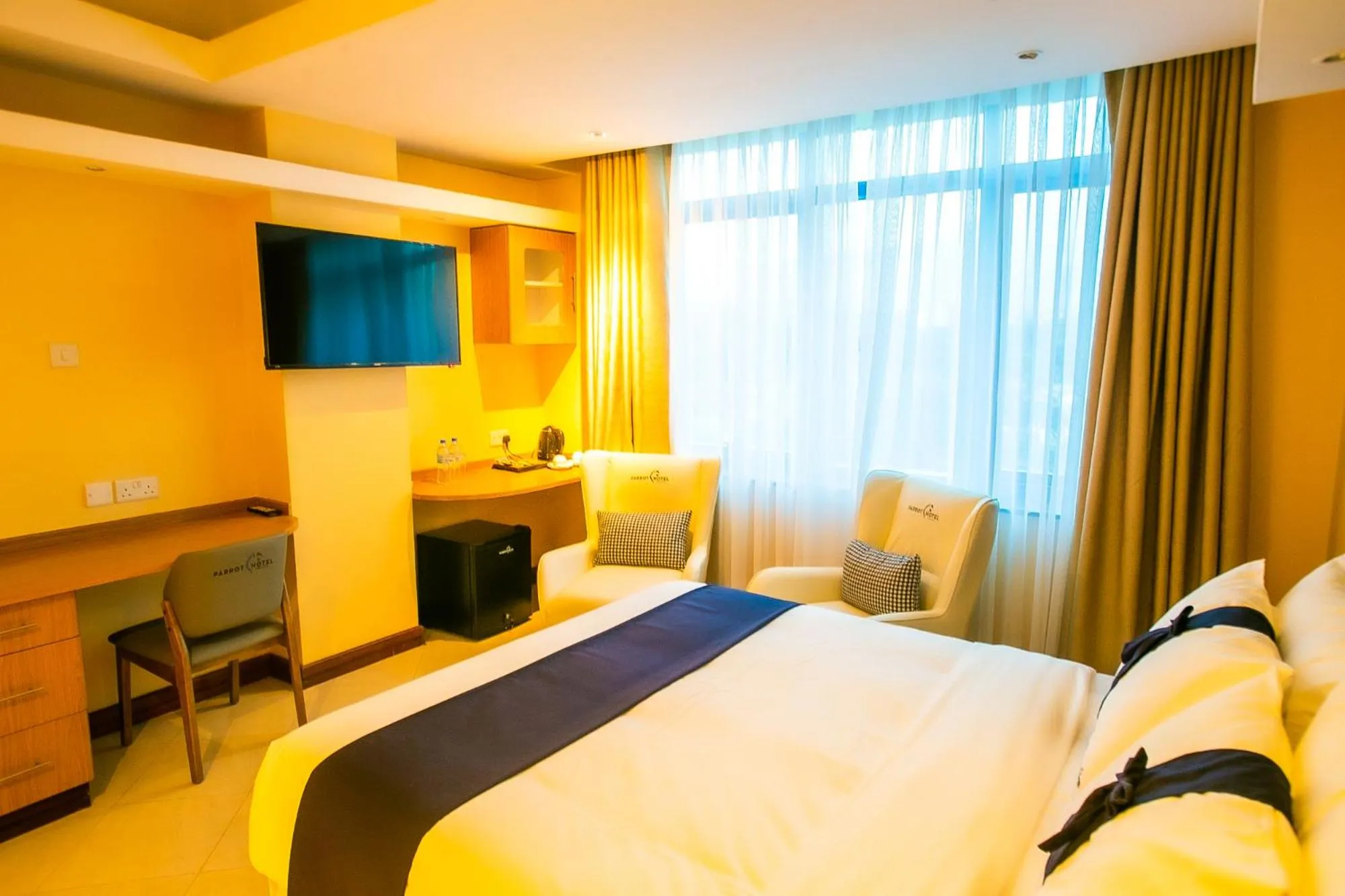 Communal lounge/ TV room in Parrot Hotel Arusha