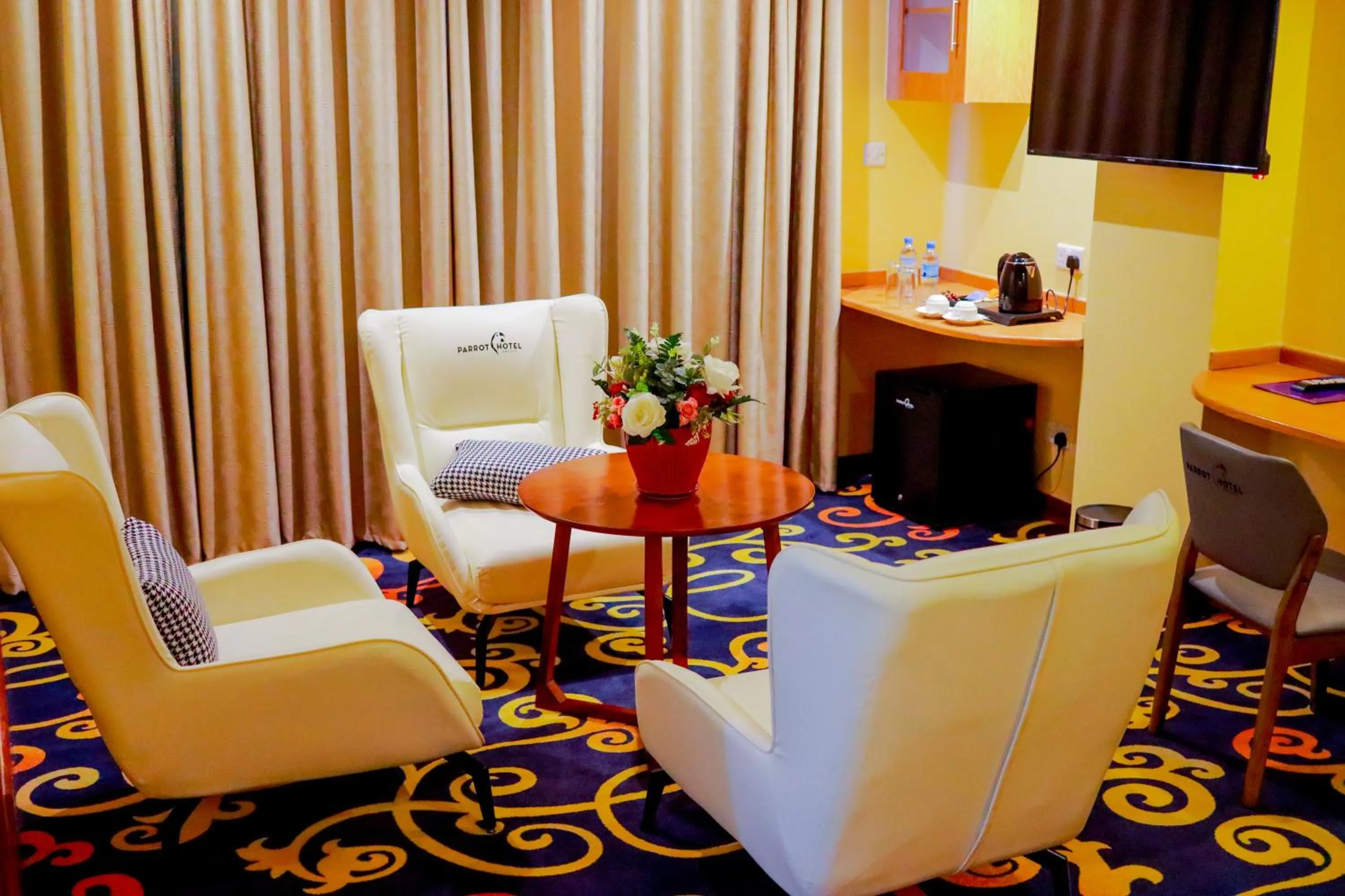 Seating area in Parrot Hotel Arusha