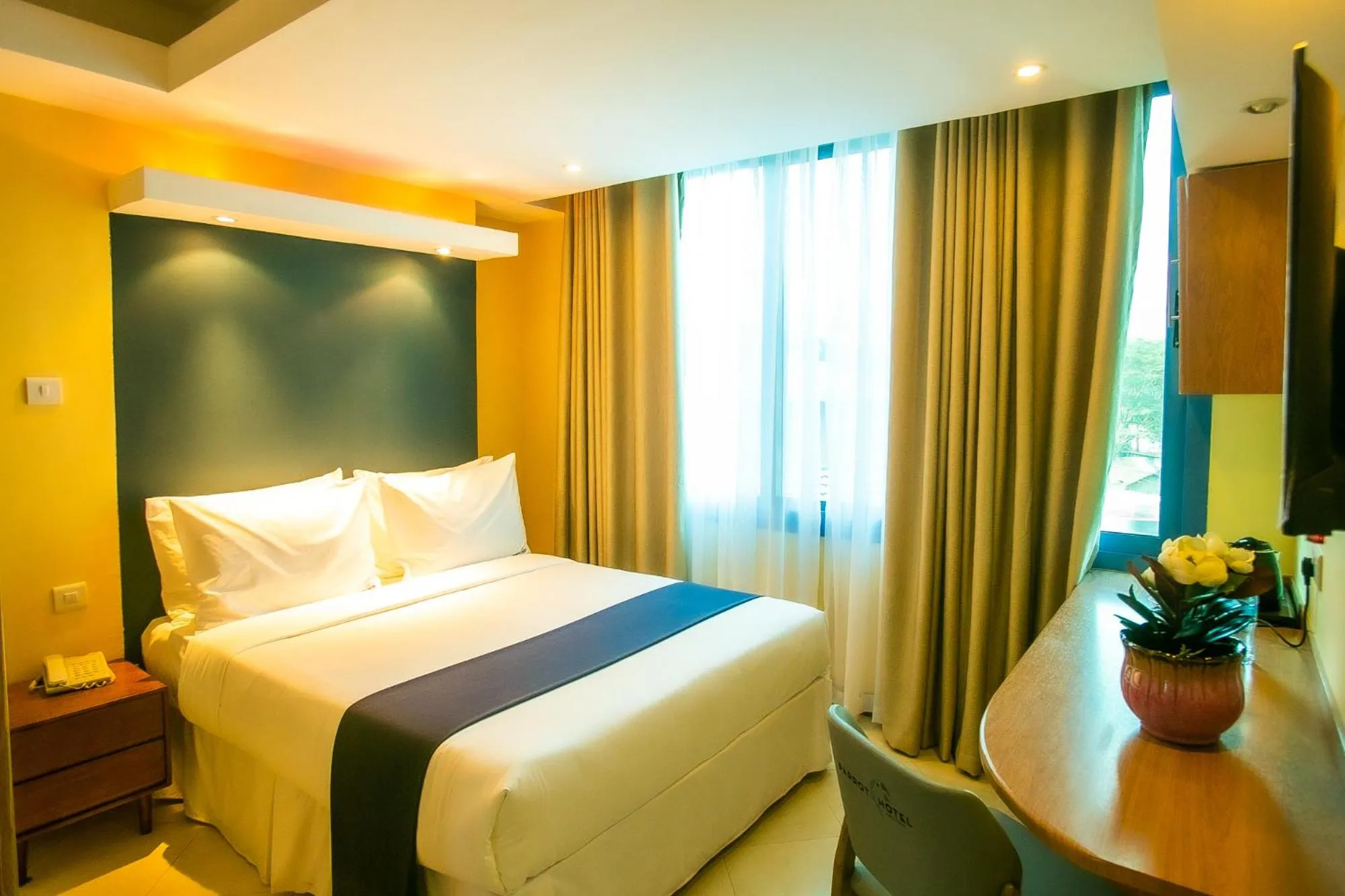 Bed in Parrot Hotel Arusha