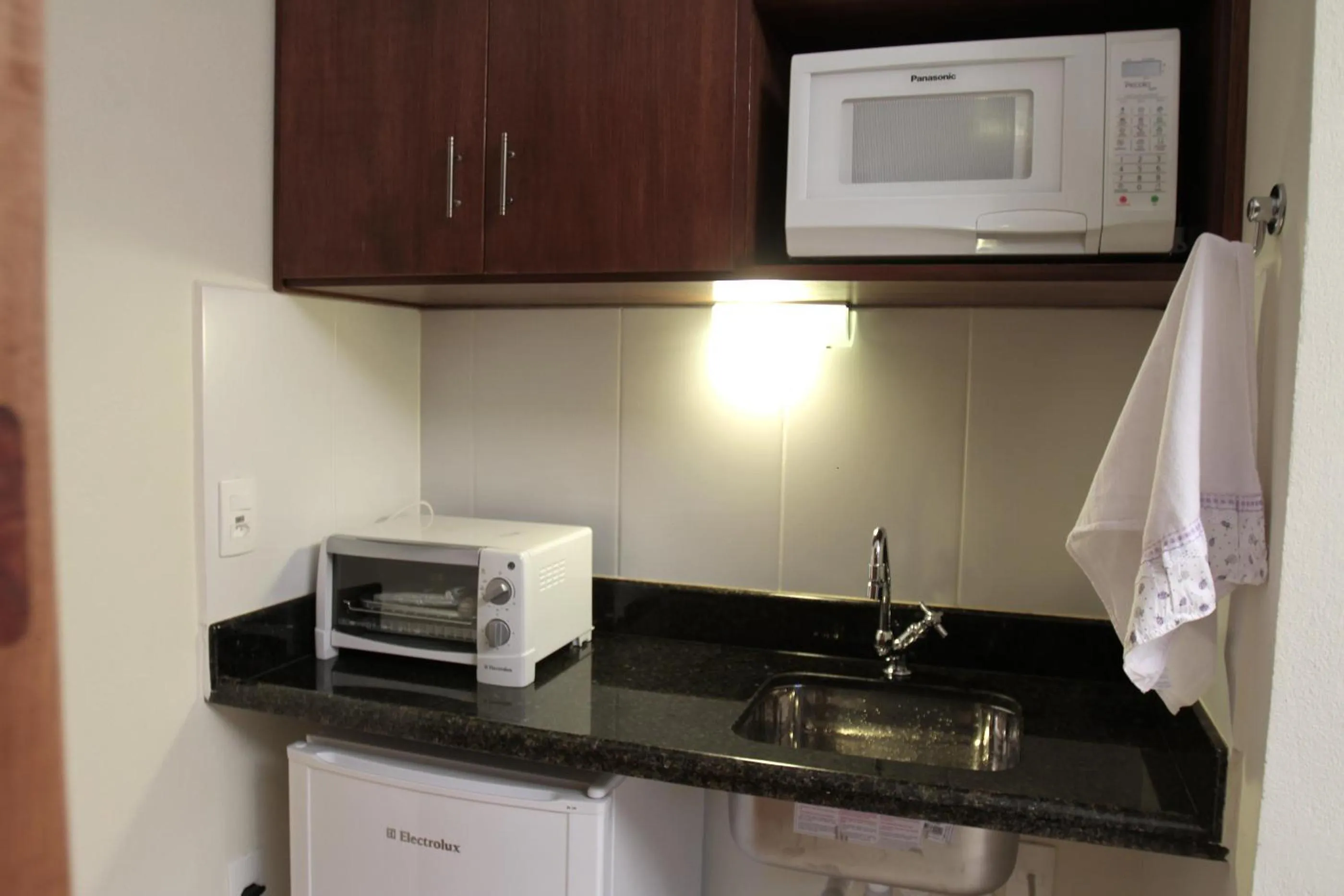 Kitchen or kitchenette in Pousada Chalé da Floresta