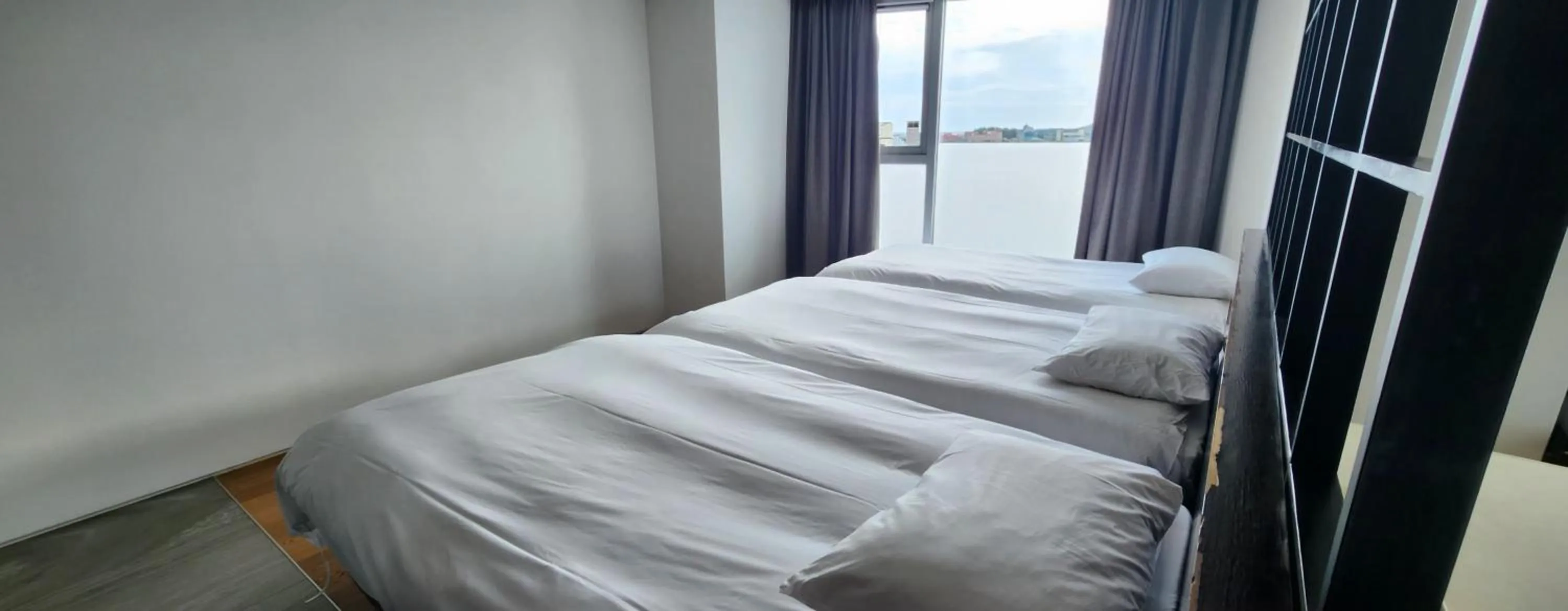 Bed in Sungsan Marina Hotel