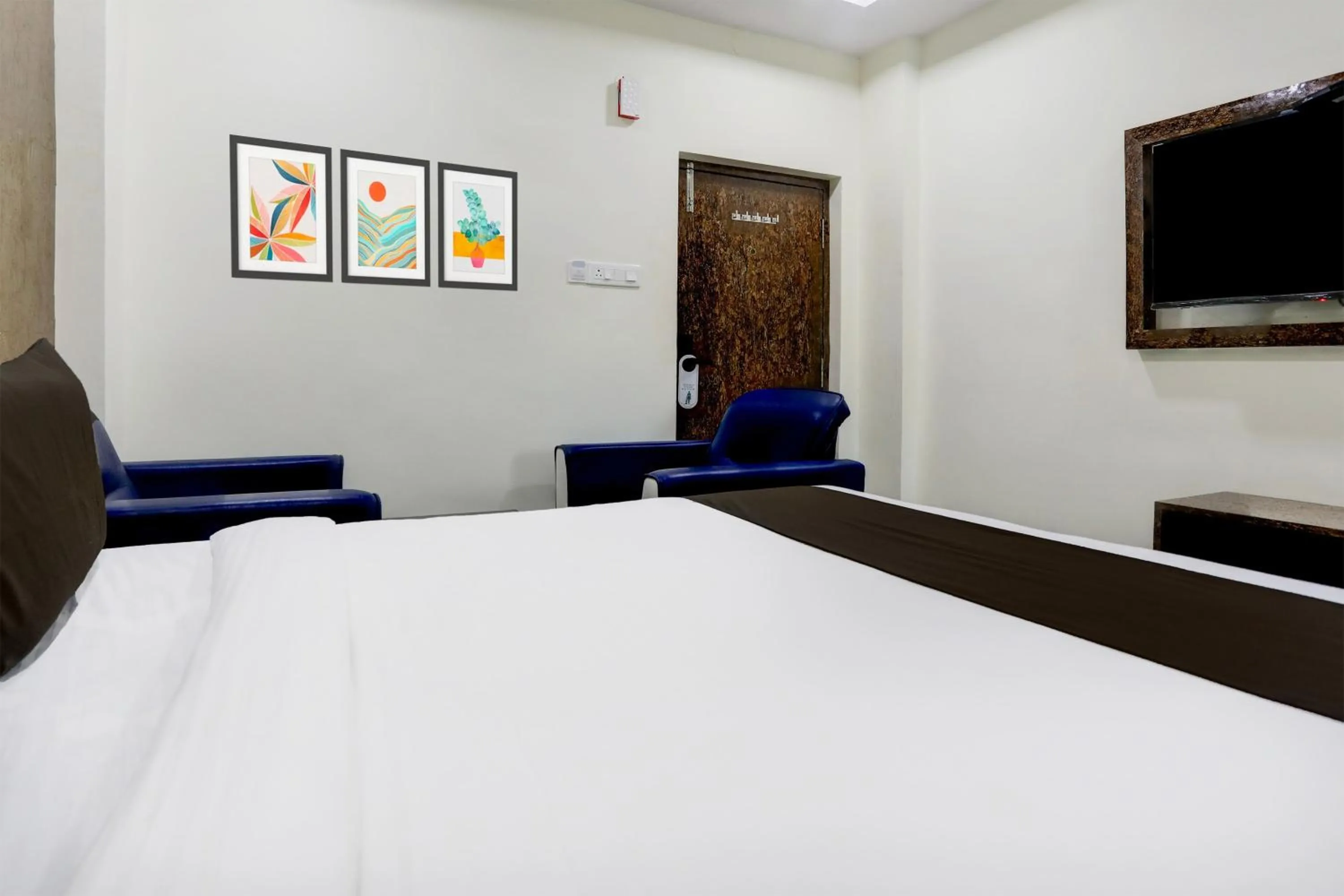 Bedroom, Bed in Super Townhouse Khammam Formerly Bluemoon