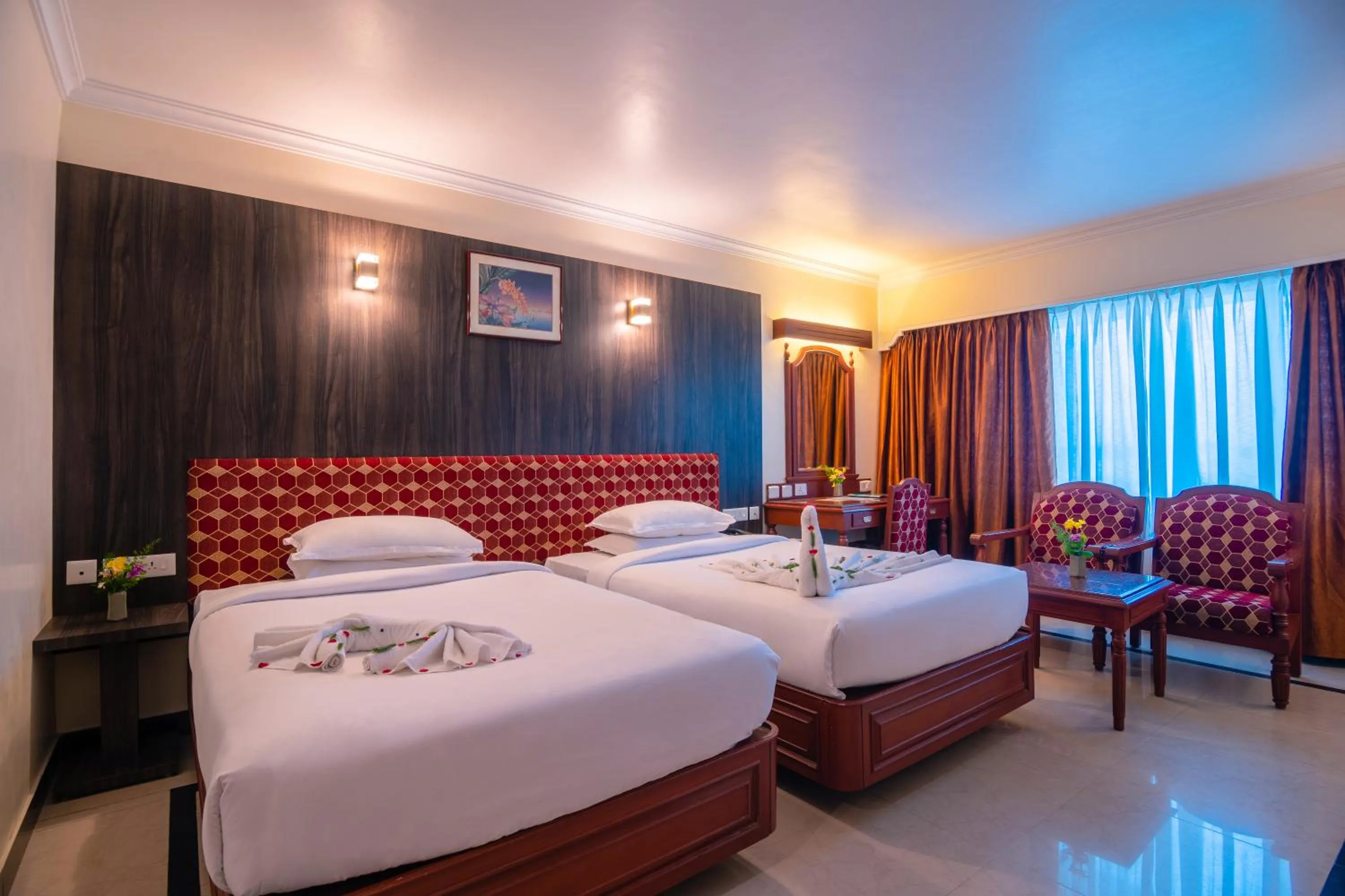 Bed in Hotel Annamalai International