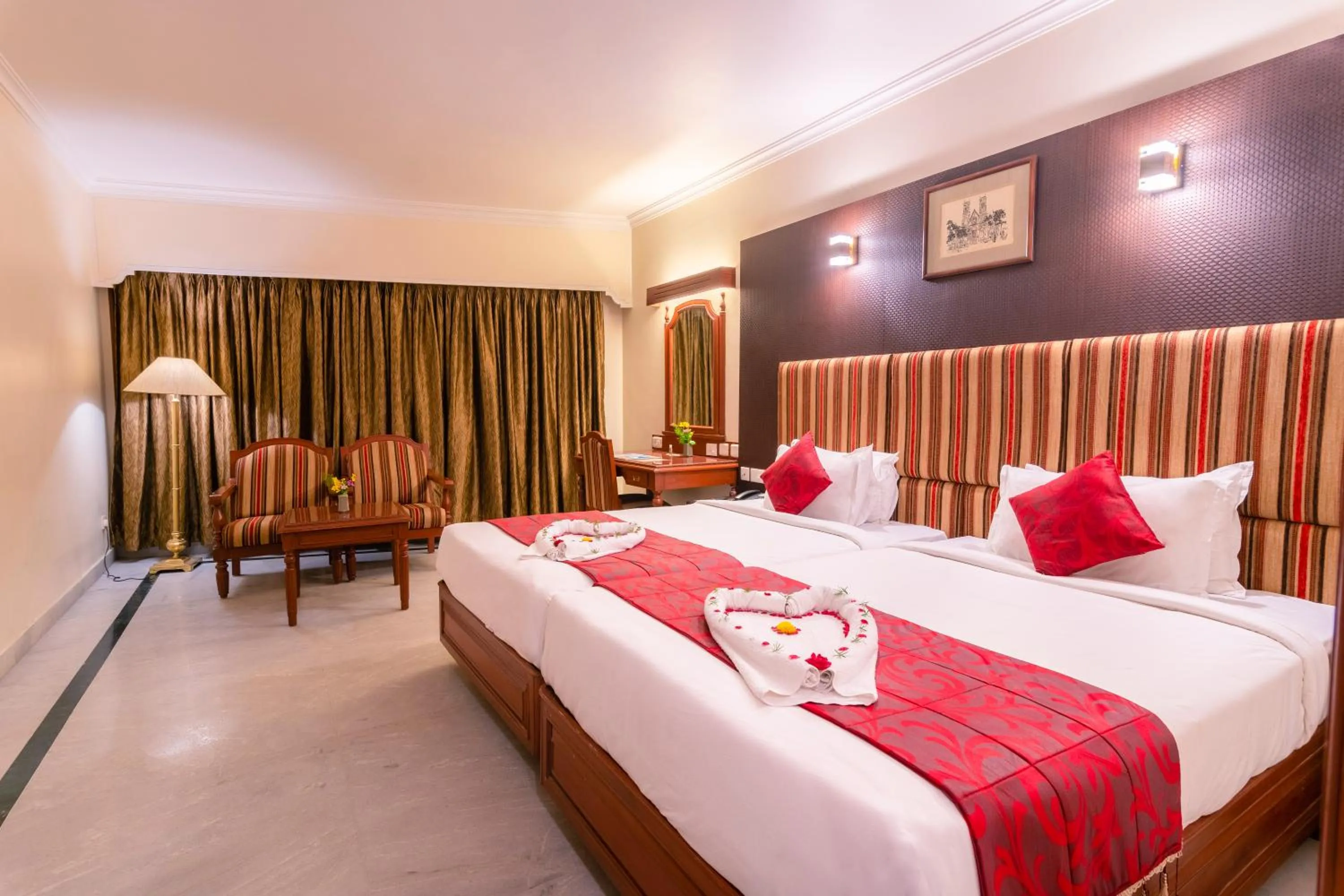 Bed in Hotel Annamalai International