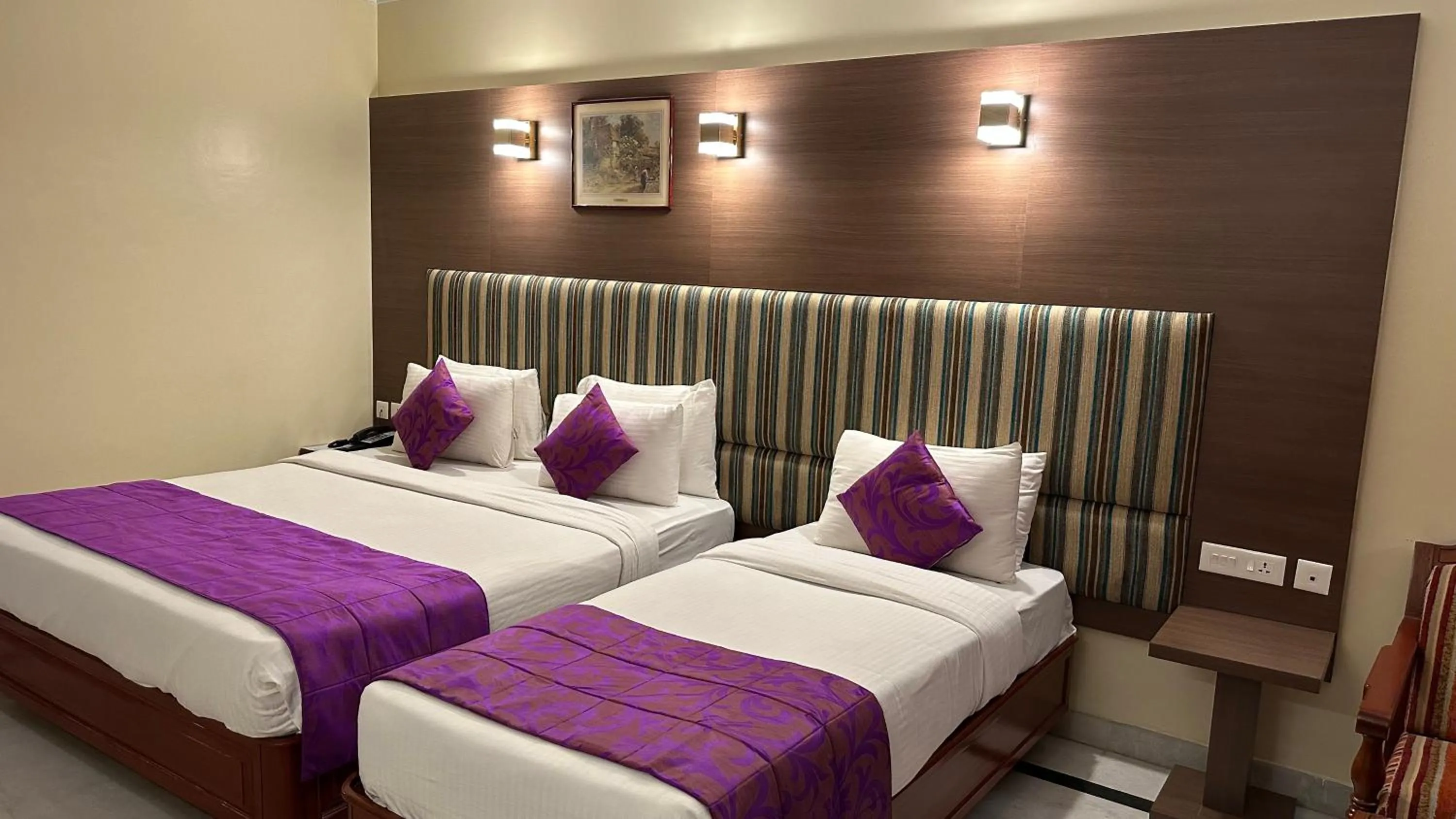 Bed in Hotel Annamalai International