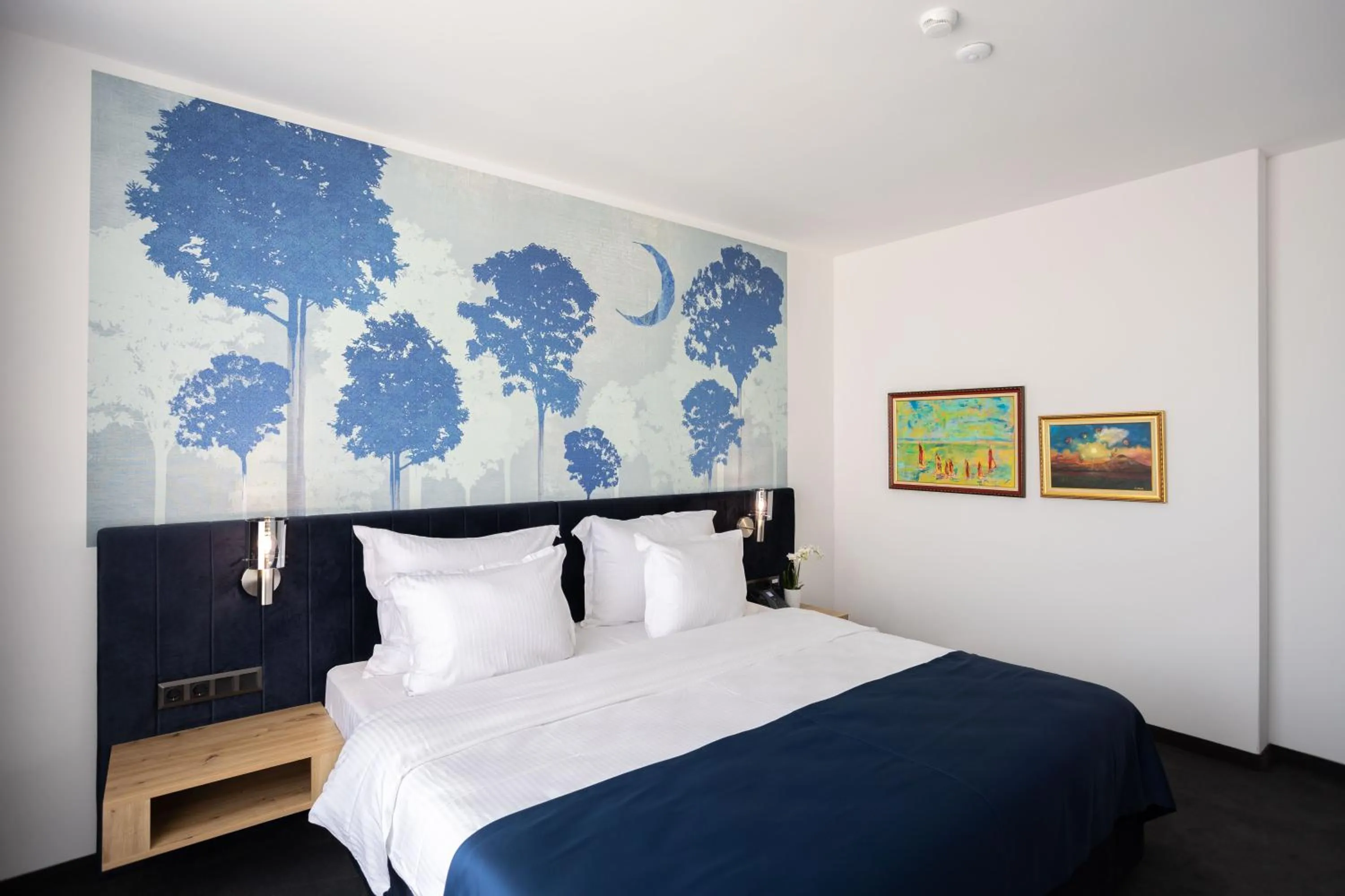 Bed in Blue Star Luxury Hotel